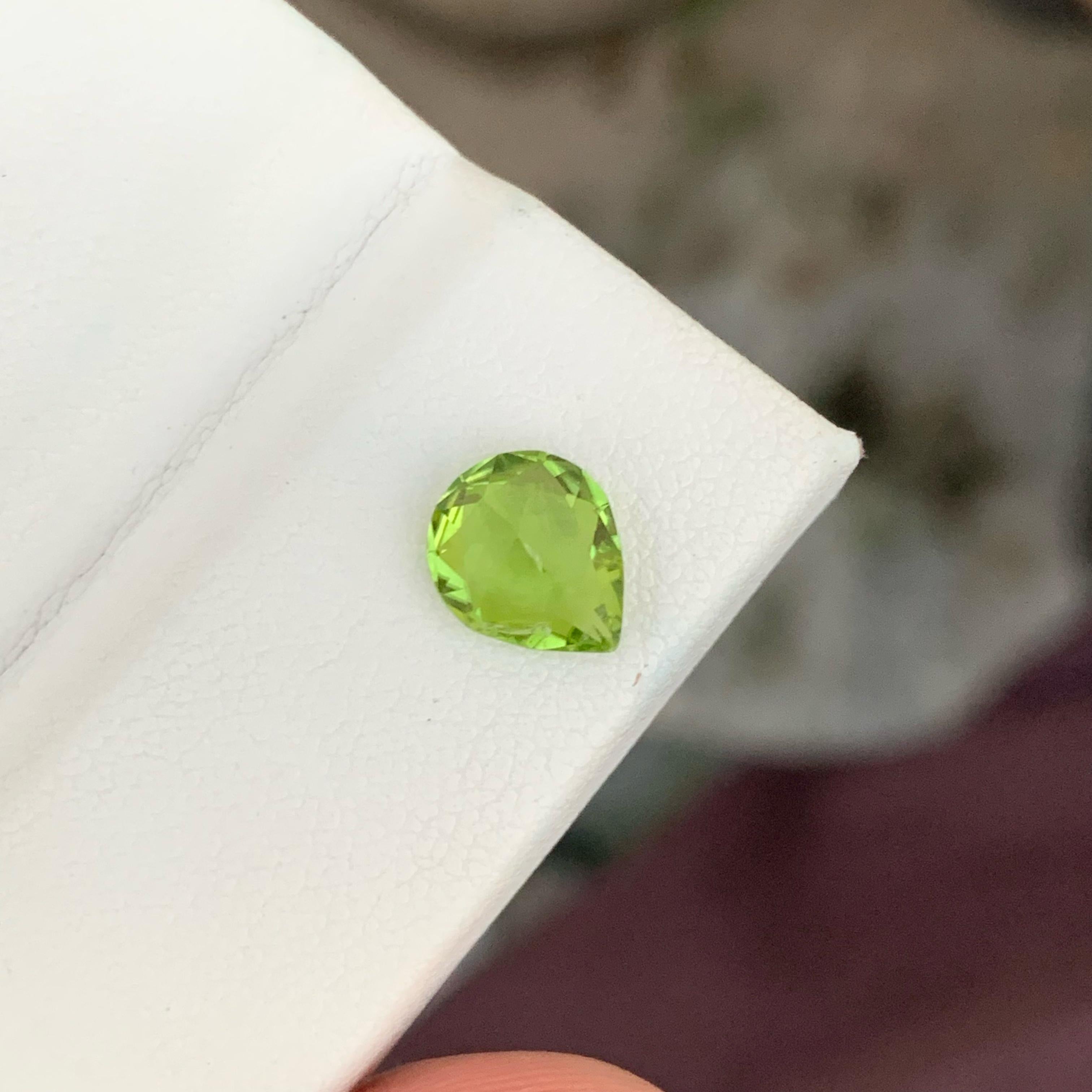 Women's or Men's Essence of Green Peridot 1.70 carats Pear Cut Natural Loose Pakistani Gemstone For Sale