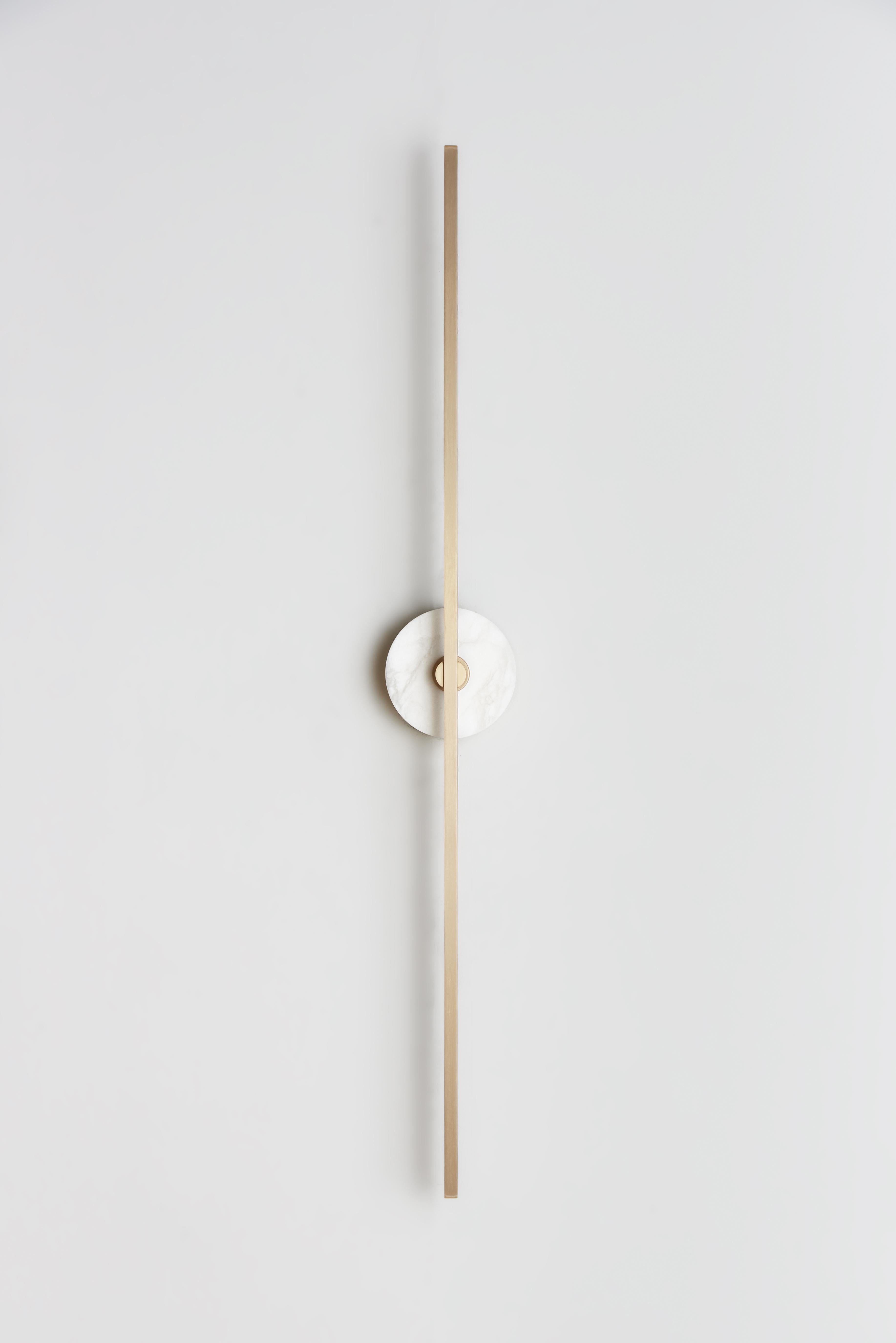 The Grand Stick wall sconce is a stylish and functional lighting fixture that blends minimalist design with advanced LED technology. The use of brass profiles gives it a sleek and elegant look, while the LED lights provide warm and diffused lighting