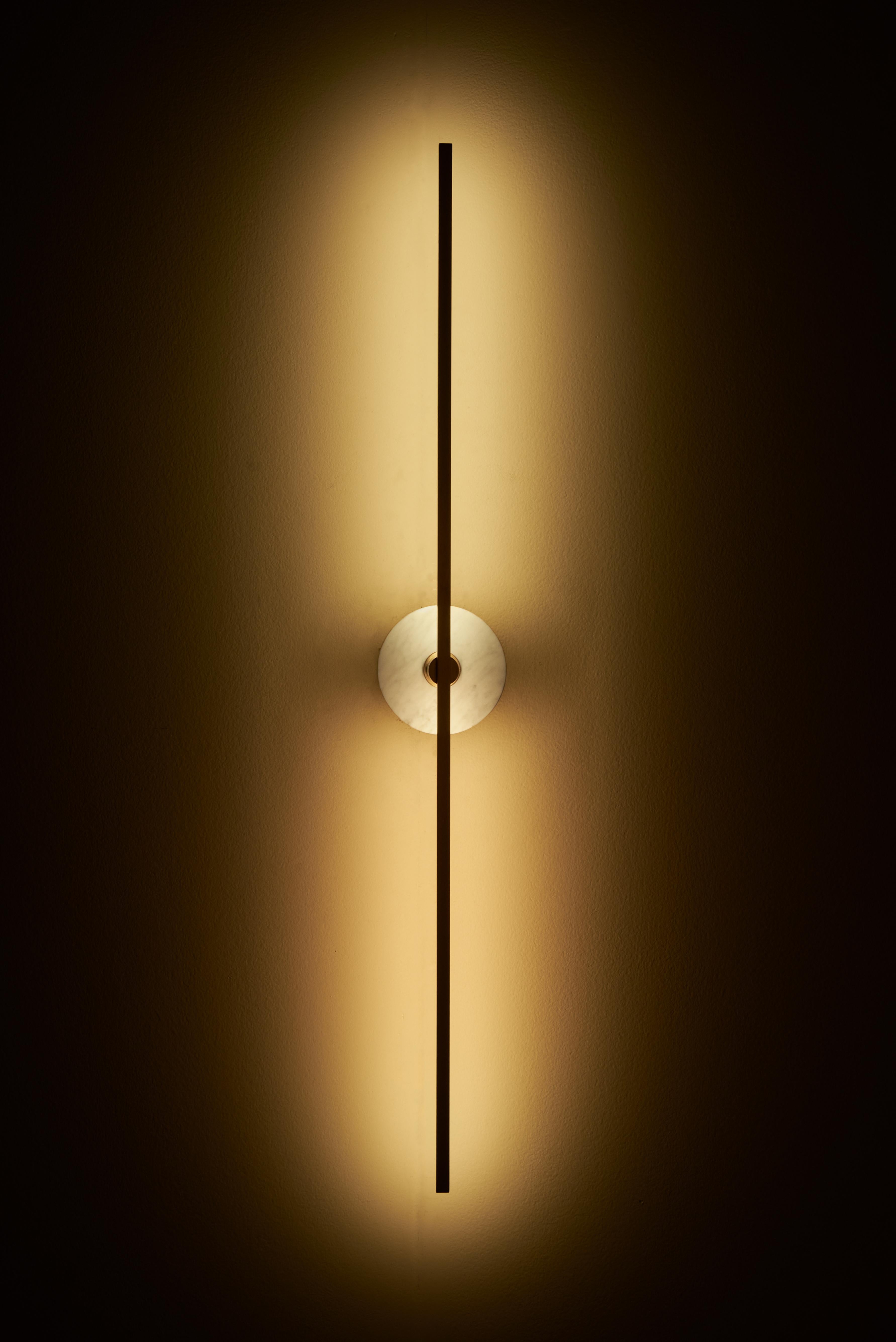 The Grand stick wall sconce is a contemporary lighting fixture that features a Minimalist design with thin brass profiles and advanced LED technology. It emits a warm and diffused light that adds a cozy and inviting atmosphere to any room.

The