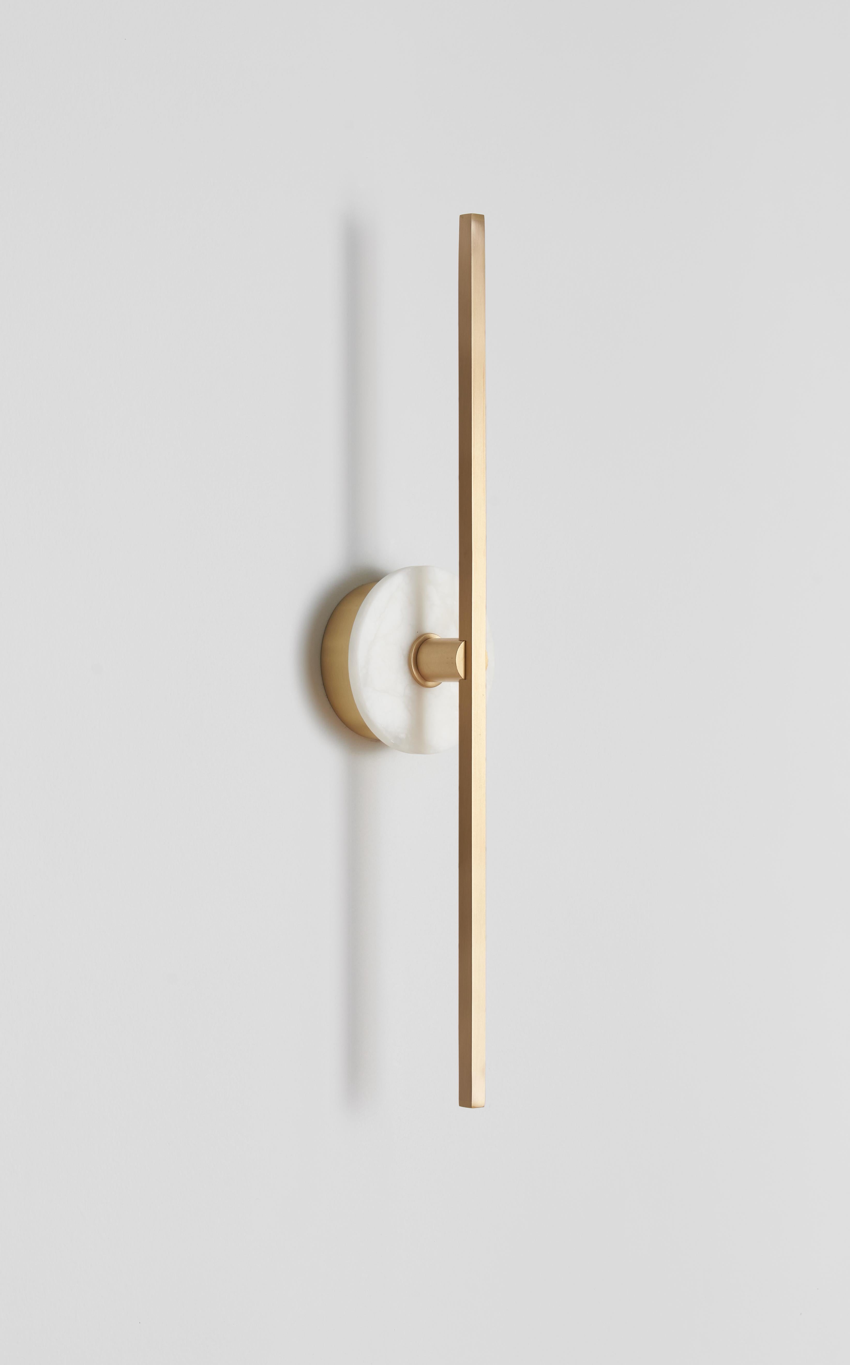 The Stick wall sconce combines the minimalism of thin brass profiles with the functionality and power of led technology.
The use of thin brass profiles creates a minimalist look that is both elegant and functional, while the incorporation of LED