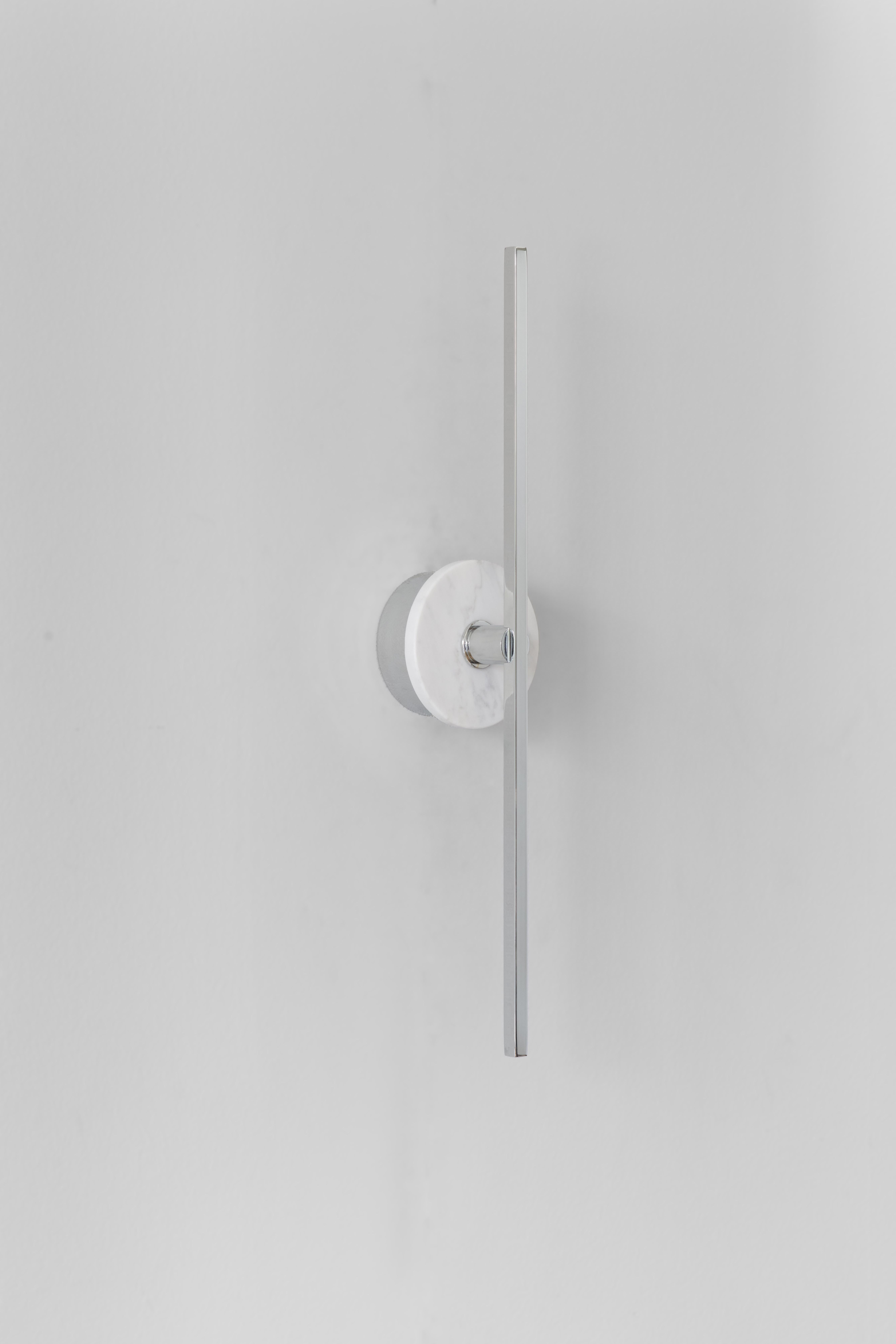 The stick wall sconce is a contemporary lighting fixture that features a Minimalist design with thin brass profiles and advanced LED technology. It emits a warm and diffused light that adds a cozy and inviting atmosphere to any room.

The white
