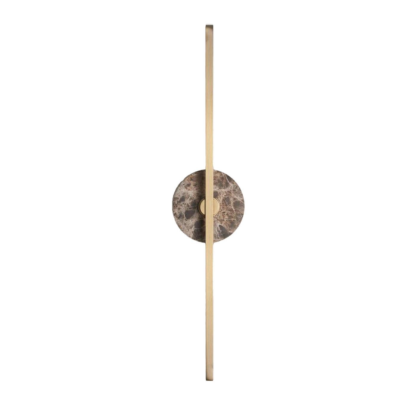 The Stick wall sconce combines the minimalism of thin brass profiles with the functionality and power of led technology, offering a warm and diffused light. The marble, pure decorative element, embellishes the structure of the product with a note of
