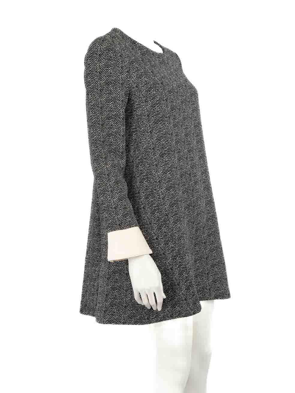 CONDITION is Very good. Hardly any visible wear to dress is evident on this used Essentiel Antwerp designer resale item.
 
 
 
 Details
 
 
 Black
 
 Polyester
 
 Dress
 
 Zigzag pattern
 
 Round neck
 
 Long sleeves
 
 Knee length
 
 2x Side