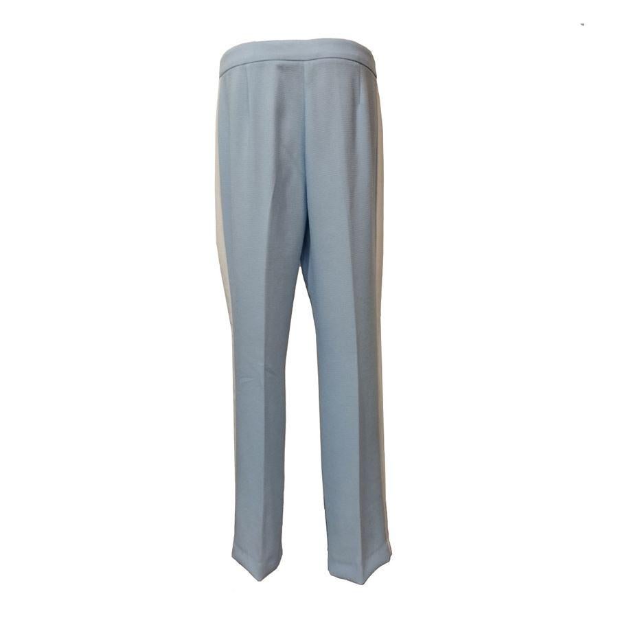 100% Polyester Turquoise color White lateral band 2 Pockets Total length cm 108 (42,5 inches) Waist cm 43 (16,9 inches)