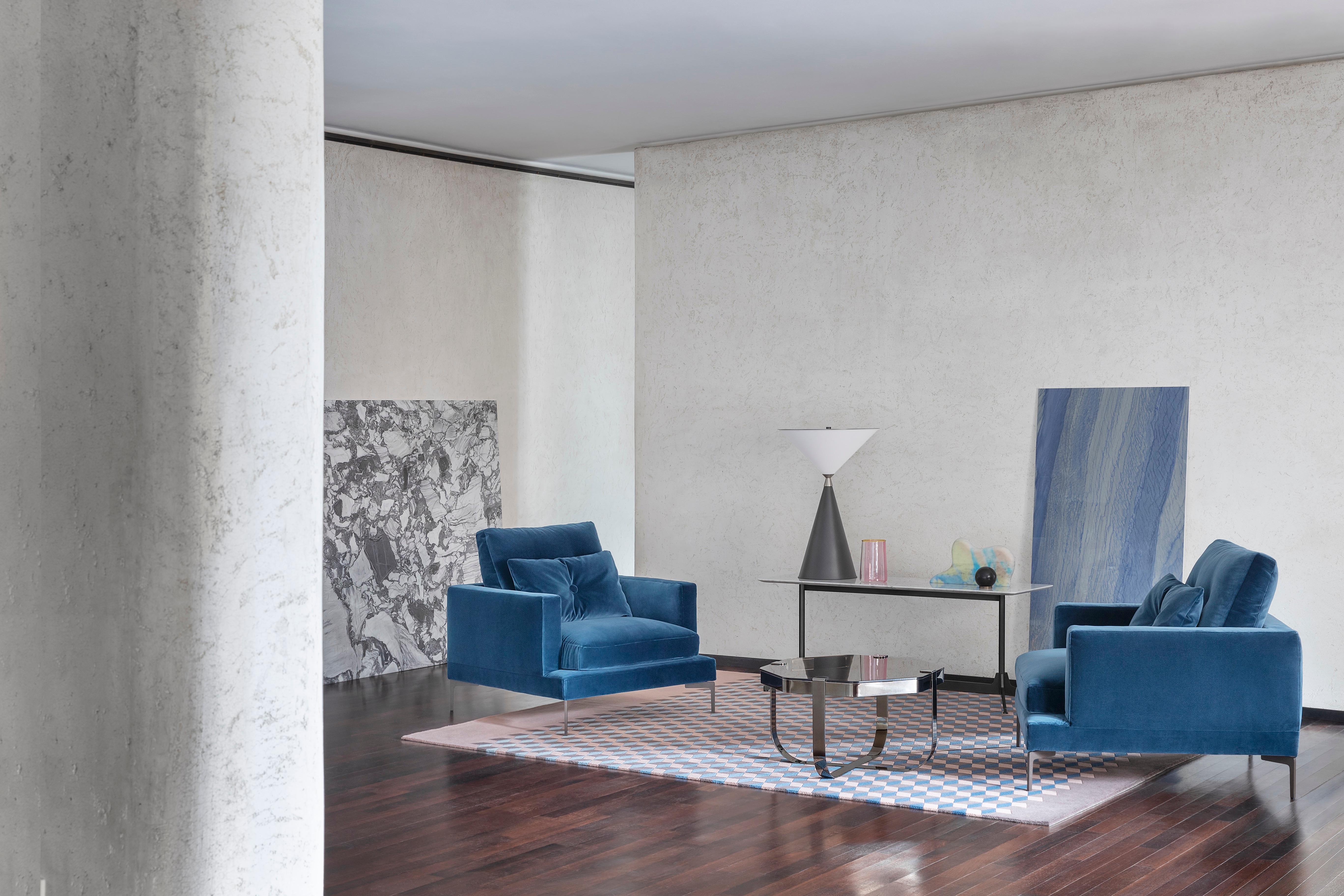 The Essentiel armchair was born with a clear mission: uncluttered, soft and welcoming, in design terms it magnificently fuses clean Scandinavian lines with traditional Italian flair. It has a clean-cut silhouette, yet it is easy to personalise by