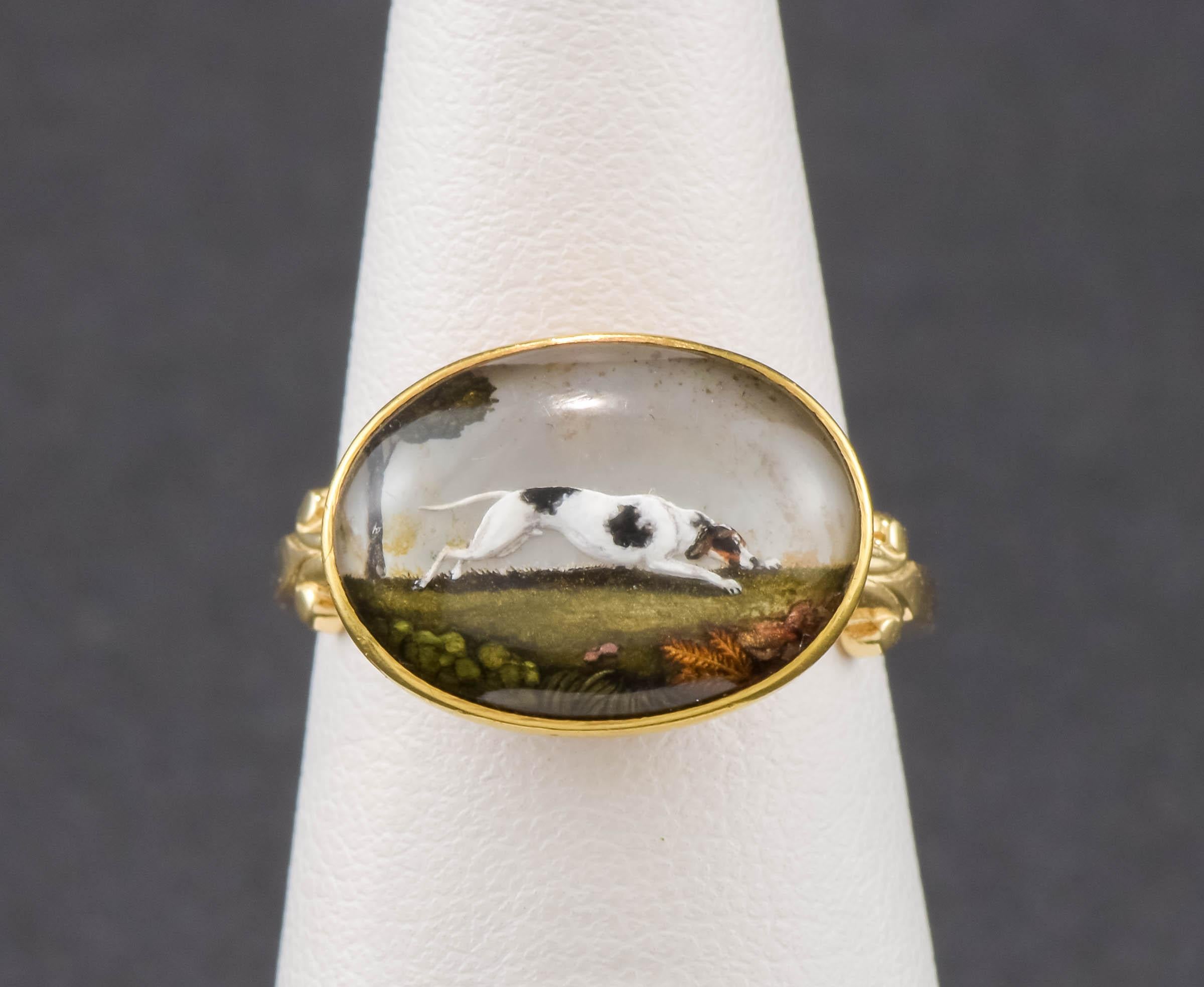 Originally part of a pair of fine 18K gold European cufflinks, this sweet running hound dog 'Essex Crystal' has been converted into a charming ring.  His brother has also been converted and is available in a separate listing.  This listing is just