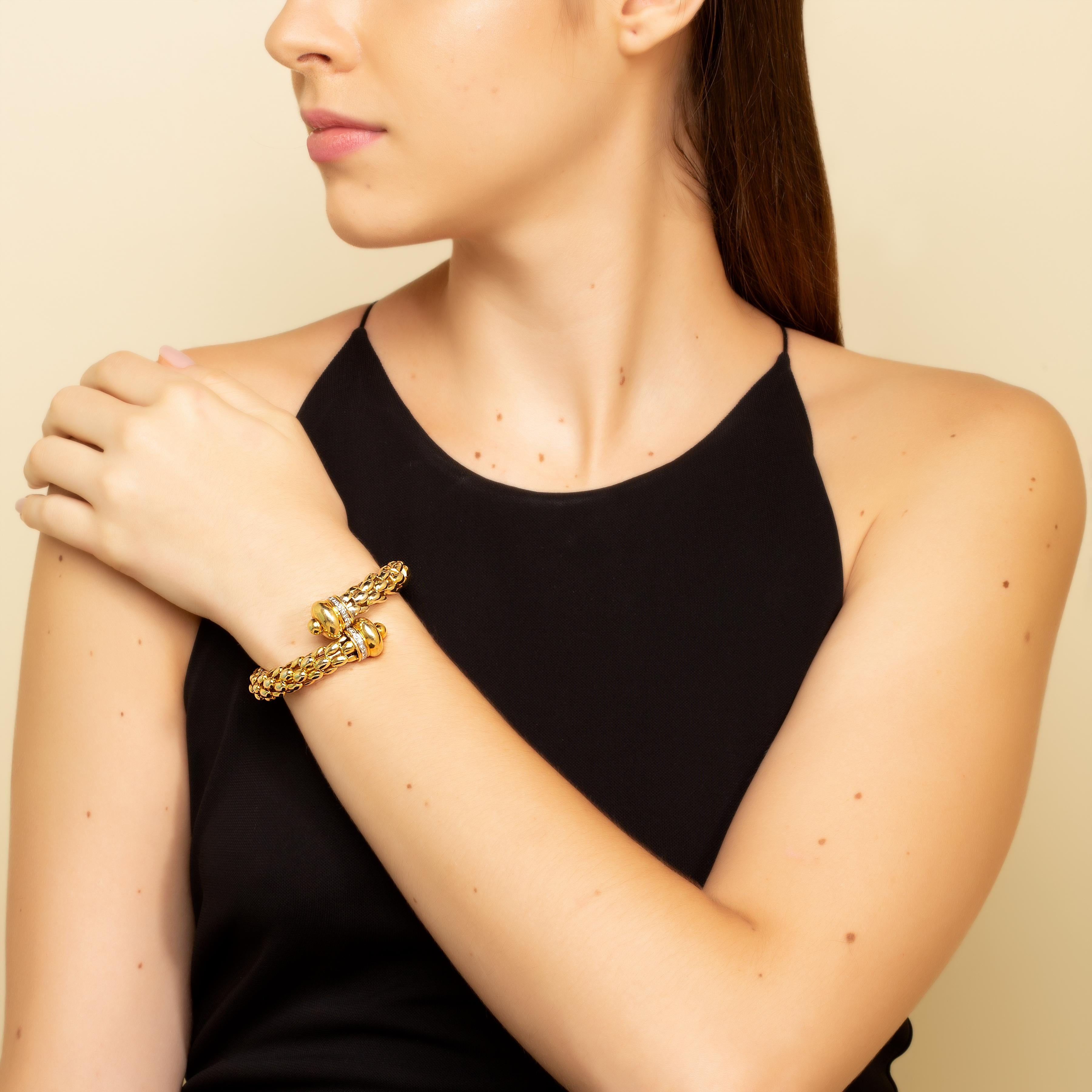 “Golden Dome Spring Chunky Bracelet“ 

Domes symbolize the heavens. Wrap it around your wrist with this spring bracelet crafted in 18KT Yellow Gold with Yellow Gold domes set with 0.29 carats of diamonds. 