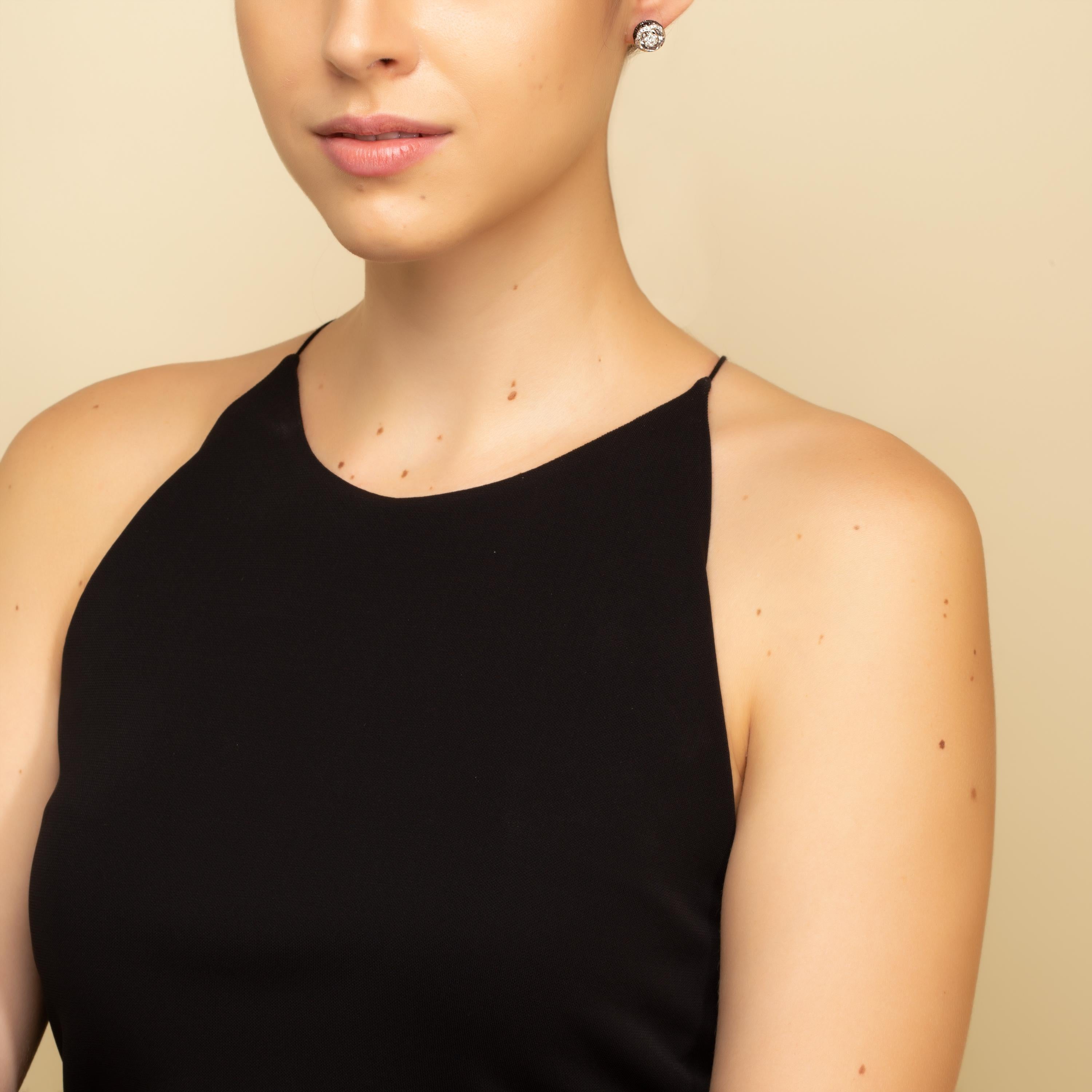 “Orbit Diamond Earrings“ 

18kt gold push-back earrings. Set with 0.35 carats of white diamonds, and 2.40 carats of Black Diamonds. 

*Free Shipping Worldwide