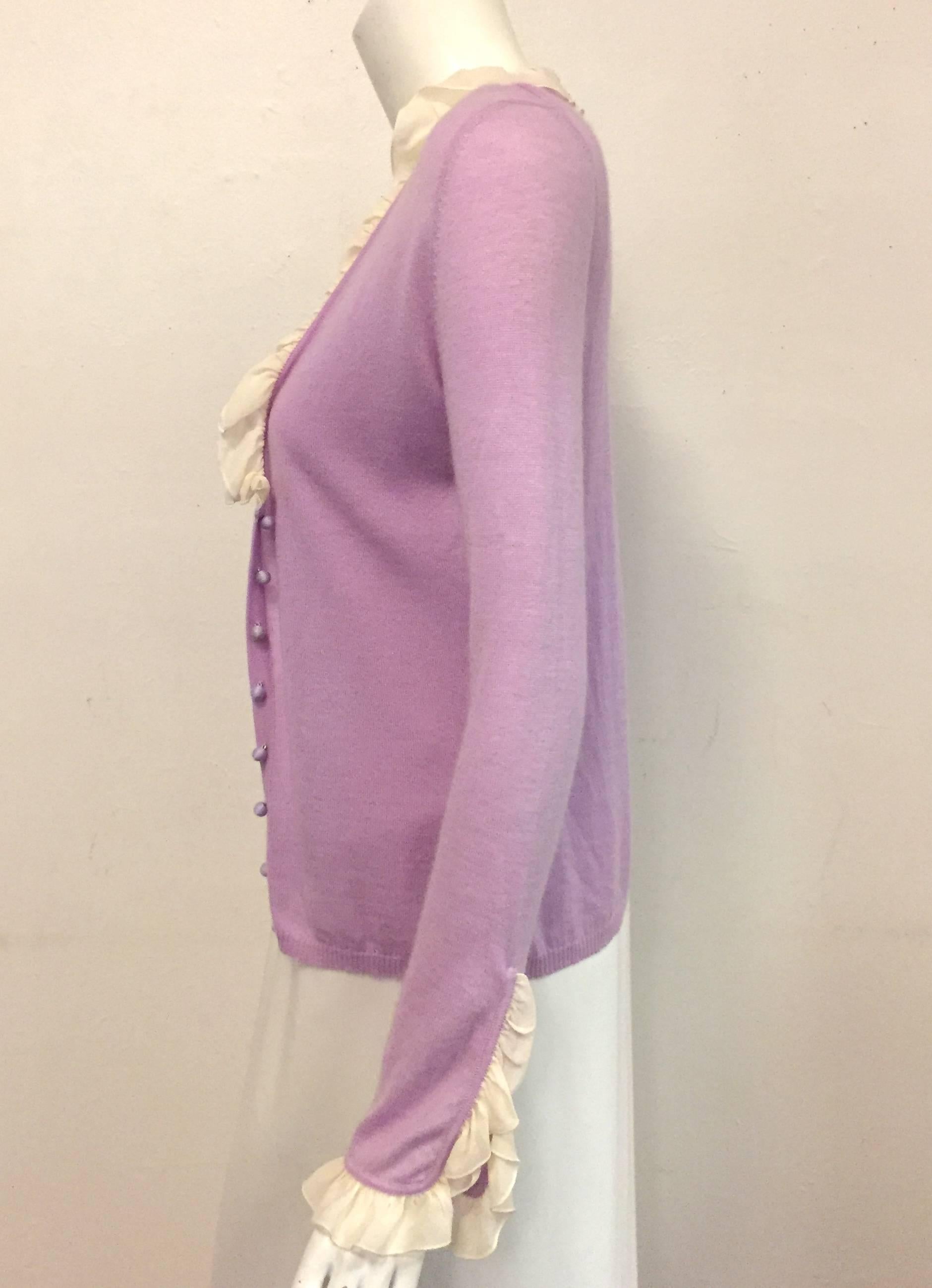 Emanuel Ungaro  lavender and beige 2 piece ensemble that includes a camisole and a cardigan with ruffles.  This twinset has no composition tag but fabric appears to be cashmere and silk crepe.  Small round thread buttons are used for closure at
