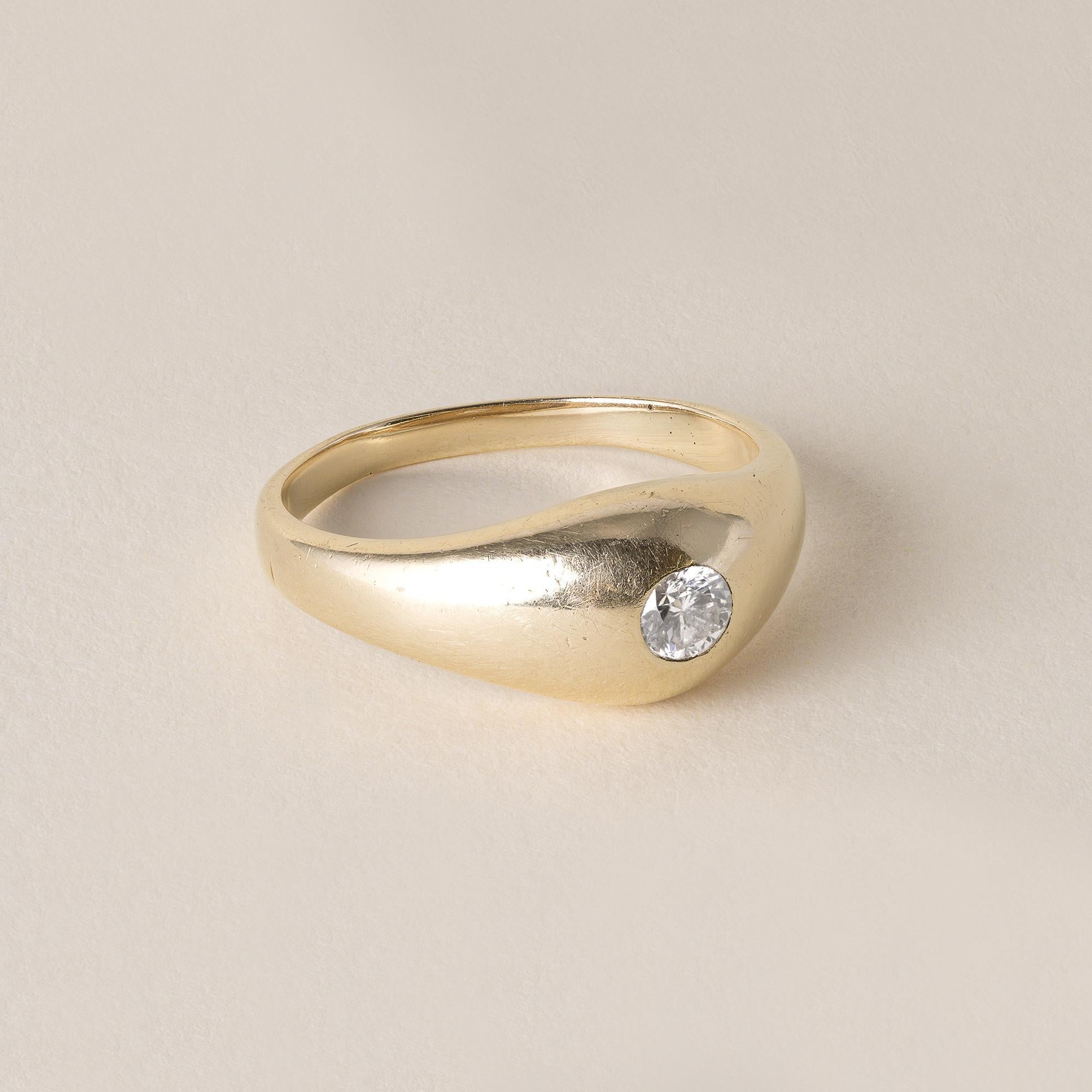 Circa 1970s
0.20 carat round brilliant diamond
F-G I1
Flush set in a gypsy style dome ring.
6.3 grams
14K marked in shank
Band measures 9.1mm at its widest point tapering down to 2.5mm
Ring size 11.5