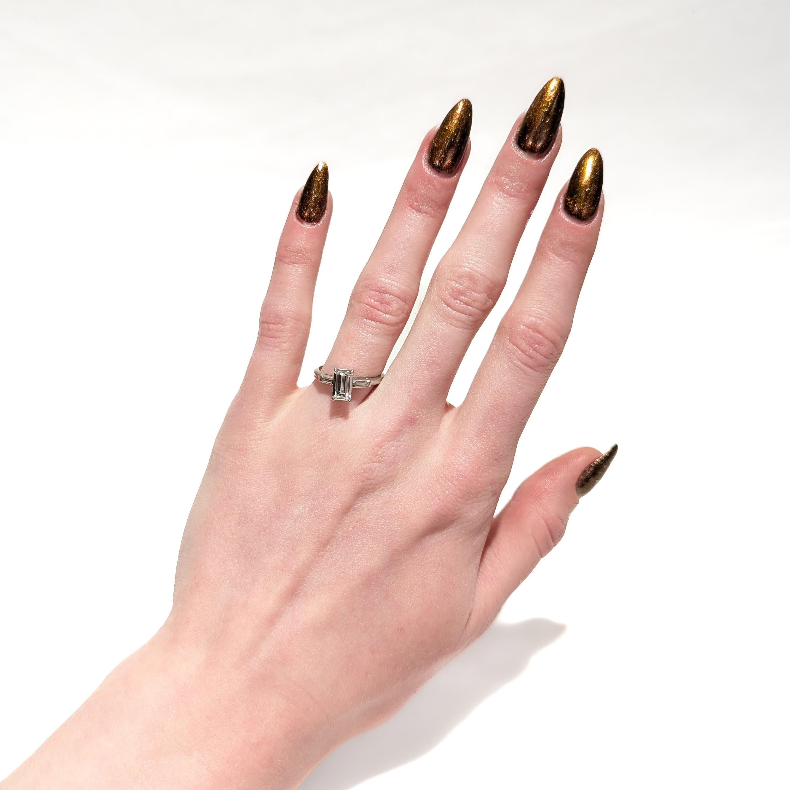 Retro Estate 0.60 Ctw Baguette Diamond & Platinum Three-Stone Ring For Sale