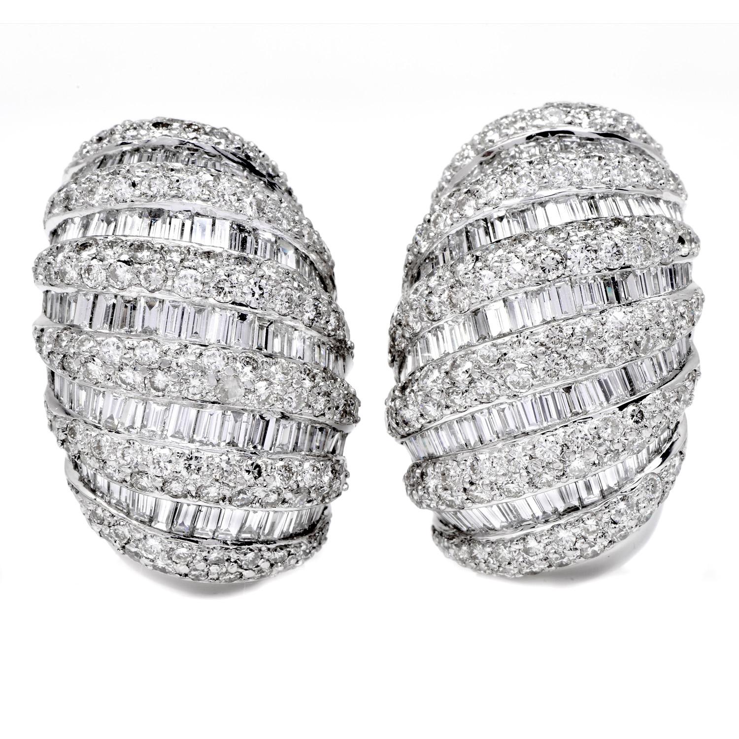 These earrings were created with unbridled imagination and

inspired by a shell Shrimp motif. Exclusively handcrafted in platinum, 

these hoop earrings measure appx. 26mm long x 17mm wide.

Rows of vibrant white round and baguette diamonds cascade