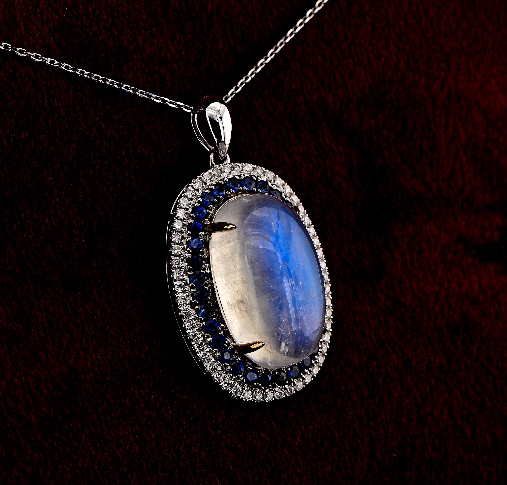 The Lunar Gemstone
This charming Rainbow Moonstone, Diamond and Sapphire pendant necklace is contemporary.
Classy, dynamic style, Art Deco Target inspired, suitable day night
Hand crafted of solid 18 KT white gold, marked
Eye catching large oval,