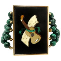 Bracciale Estate in oro 14 carati con chitarra di malachite unica nel suo genere