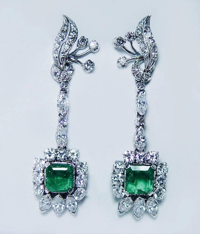 Impressively detailed estate earrings set 14 karat white gold, not stamped but jeweler tested.  Earrings are set with fiery white G colorless diamonds and genuine earth mined emeralds.

Each rectangular cut vibrant green emerald measures 7.2mm x
