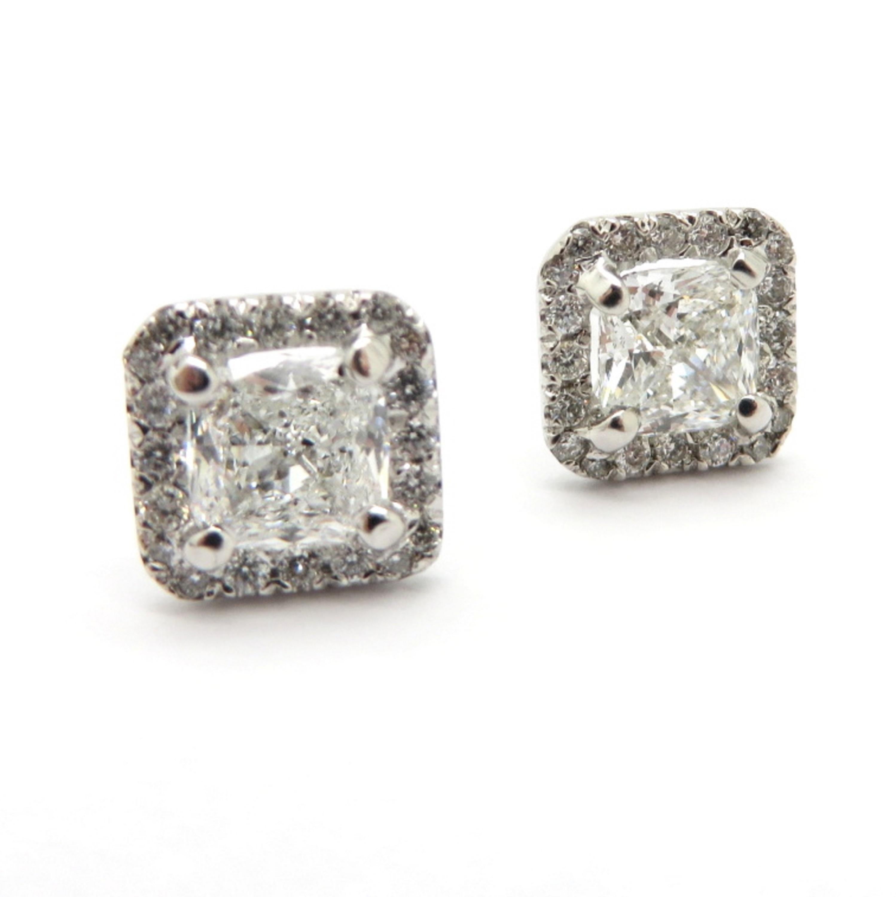 For sale is a gorgeous pair of Estate 14K White Gold Diamond Halo Cushion & Round Earrings!
Showcasing two Cushion Cut diamonds, each four prong set, weighing a combined total of 1.80 carats. Diamond Grading: Color Grade: G. Clarity Grade: VS1.