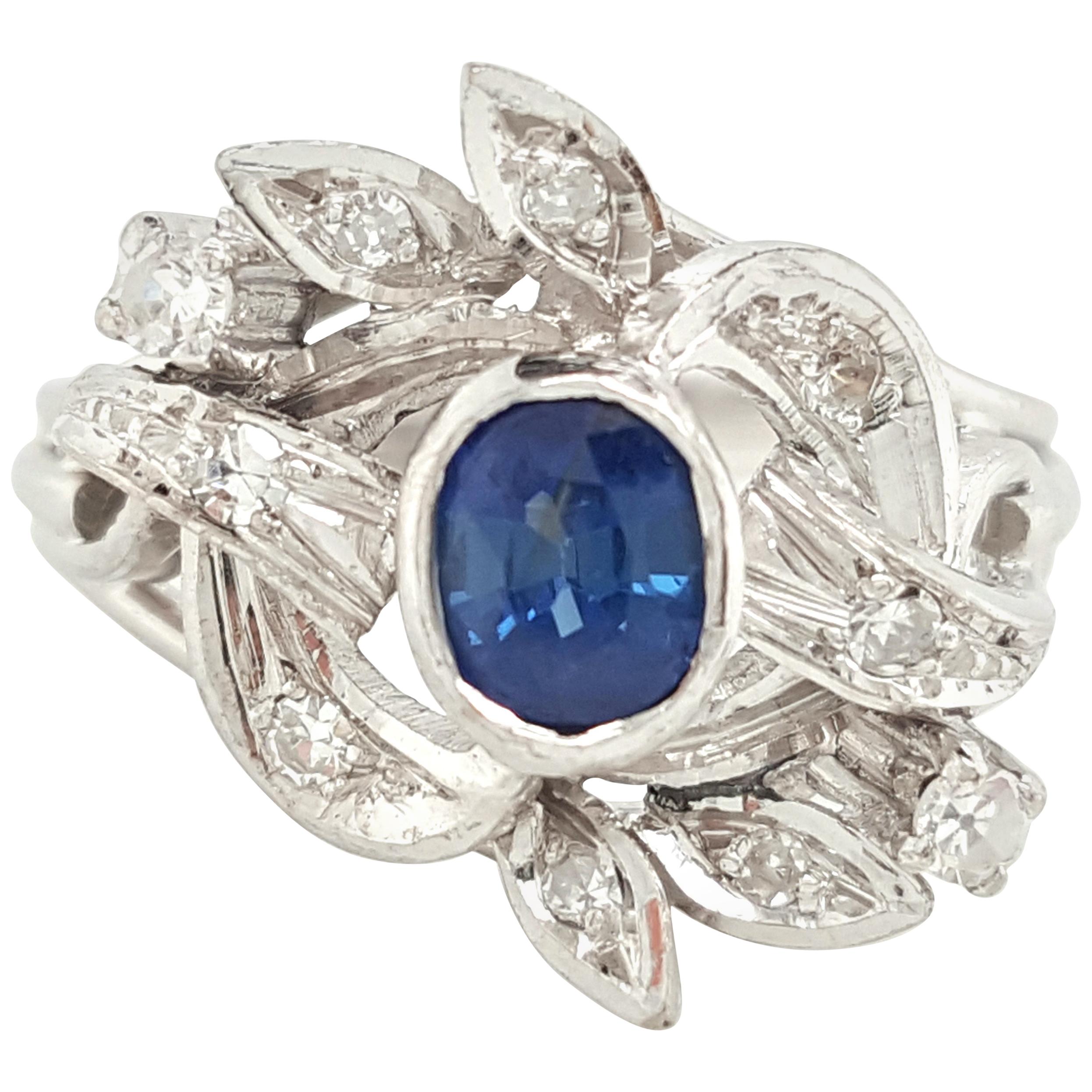 Estate 14 Karat White Gold Oval Blue Sapphire and Diamond Cocktail Ring For Sale