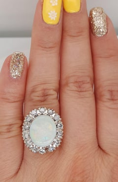 Estate 14 Karat Yellow and White Gold Oval Opal and Diamond Cocktail Ring