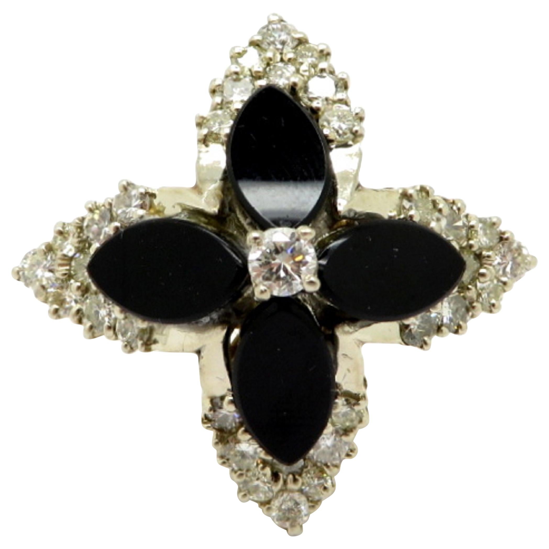 Anillo de diamantes en oro amarillo de 14 quilates con diseño de flor de ónice