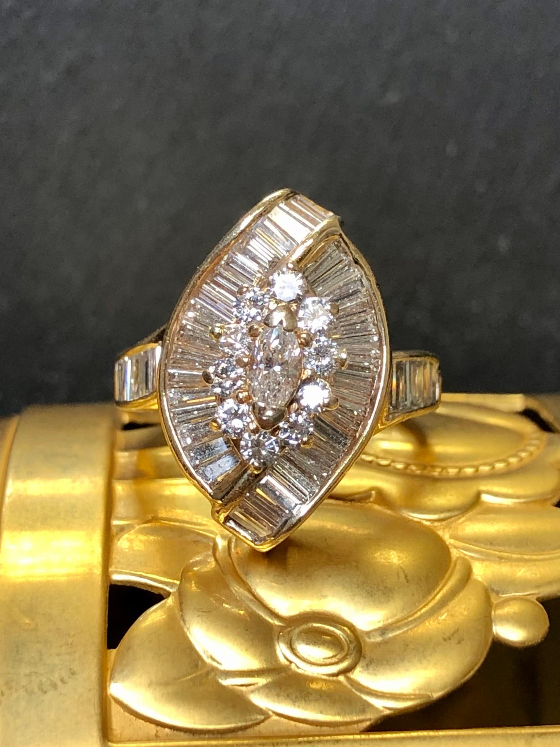 A gorgeous ring crafted in 14K yellow gold and channel/prong set with approximately 3.20cttw in H-I color Vs1-2 clarity baguette and round diamonds as well as one central marquise diamond. A fabulous show on the hand!


Dimensions/Weight:

Ring