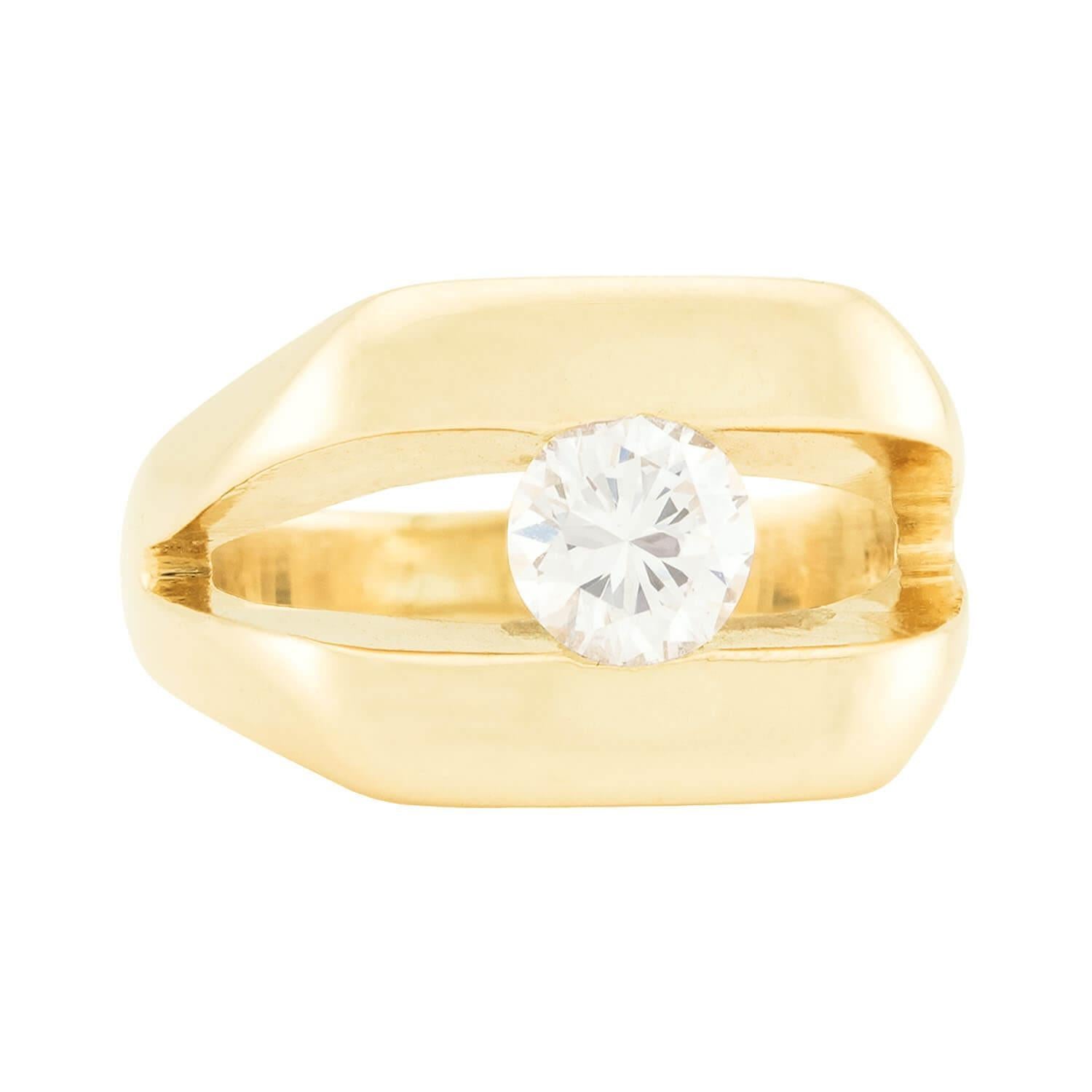 An artistic and charming diamond ring! Crafted in vibrant 14k yellow gold, this ring features a unique 