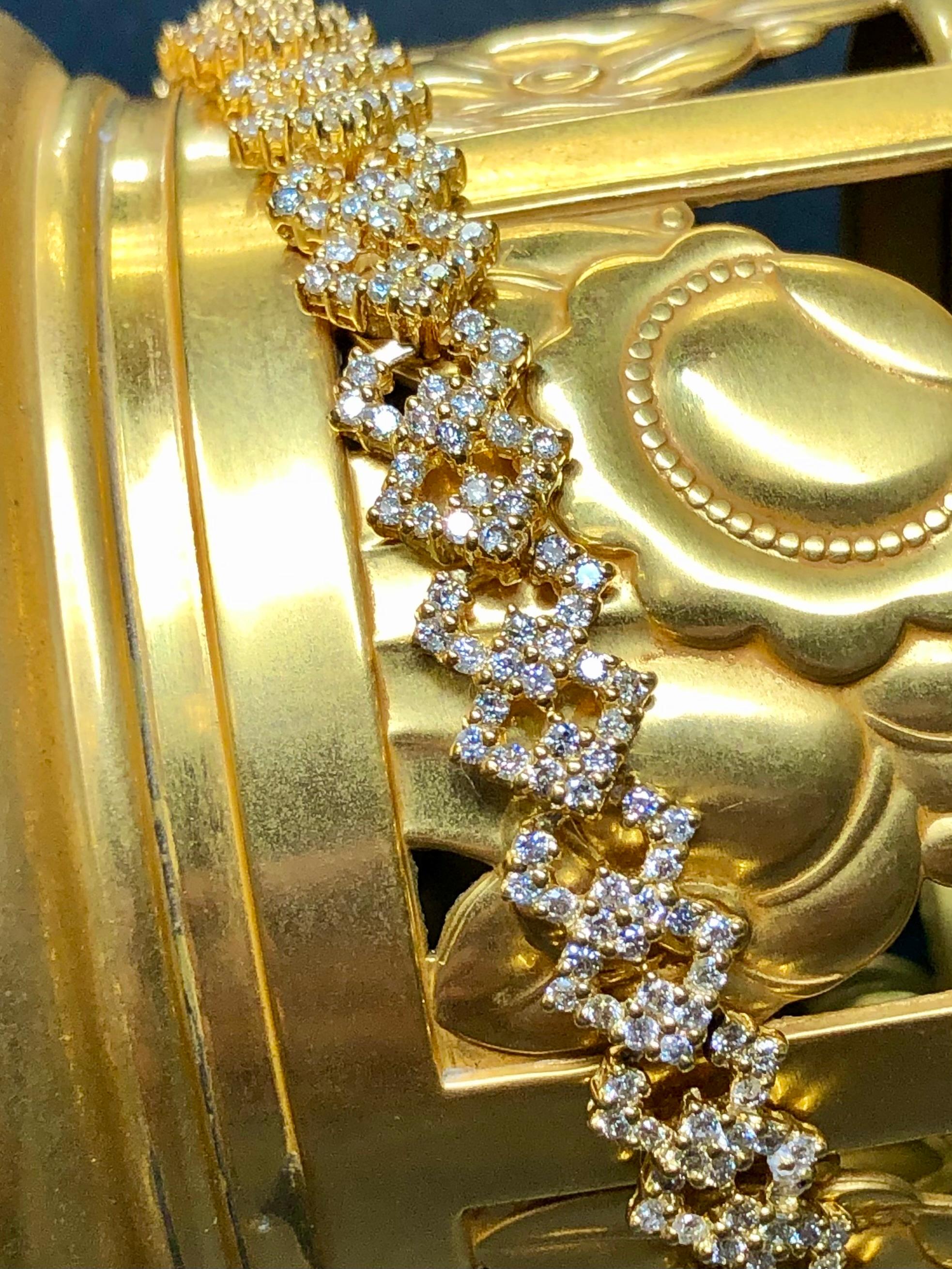 An impressive diamond line bracelet done in deep 14K yellow gold and set with approximately 5.40cttw in J-L color Si1-2 clarity round diamonds which are super bright and lovely. A beautiful and AFFORDABLE bracelet… and quite the