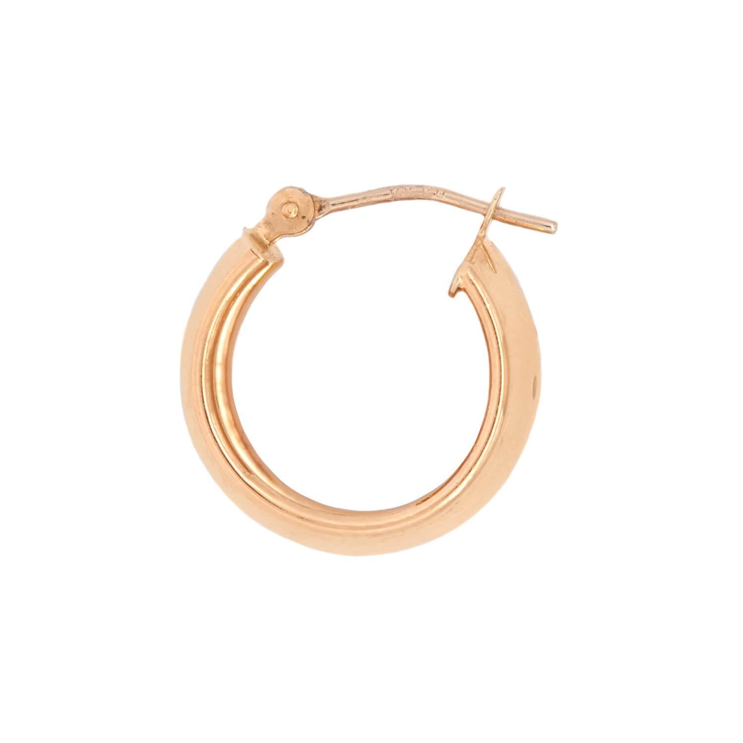 A gorgeous pair gold huggie hoop earrings! Crafted in 14k yellow gold, the surface of each earring is smooth and simple. Both outer edges of the hoop feature a slightly raised border, which adds to the feminine and dainty appeal of the pair. The