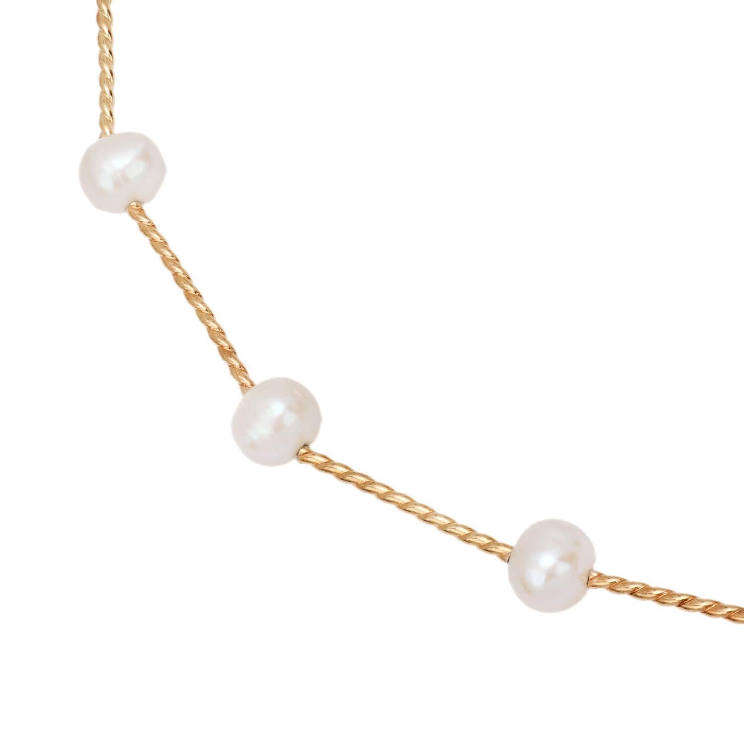 A beautiful and simple pearl chain necklace! Crafted in 14k gold yellow gold, this necklace features 16 lustrous pearls which are strung on a twisted tube chain. The eye-catching pearls range slightly in size, and do not move freely along the chain.