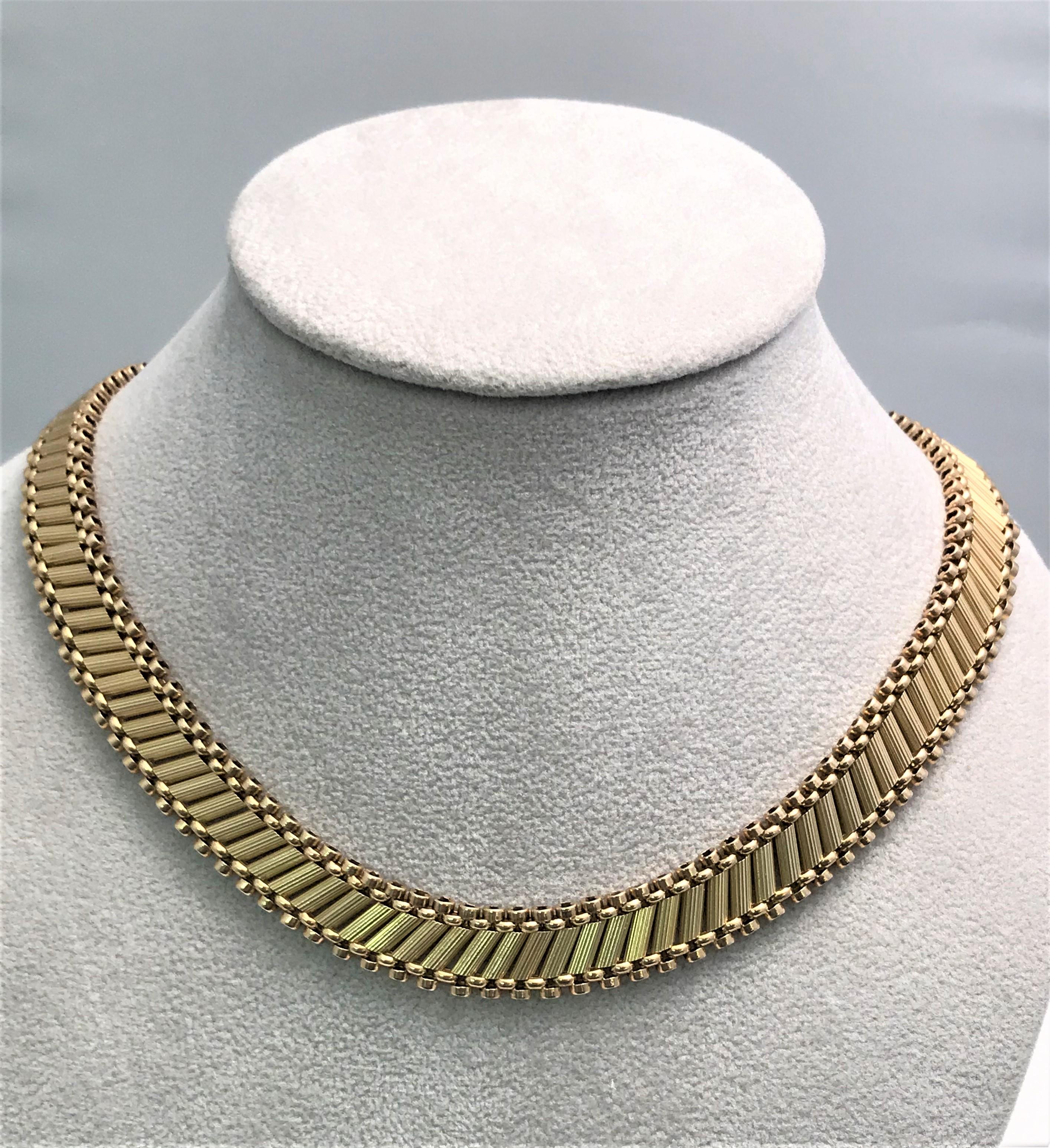 This necklace has character and style!
14 karat yellow gold.
10mm wide, rolex style.
Rests flat on the neck and is very comfortable.
Approximately 14