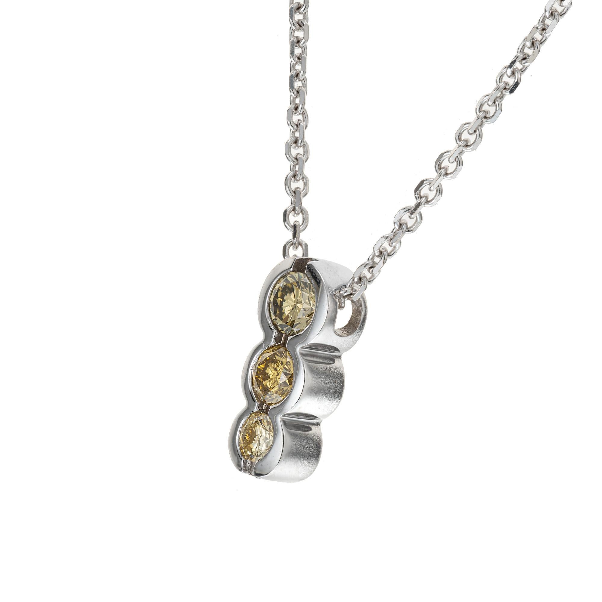 Estate 14k white gold very interesting necklace with 3 natural yellow diamonds. Well matched and in excellent condition. Slightly darker yellow at the top. Slightly lighter yellow at the bottom.

3 round natural fancy yellow diamonds approx. total