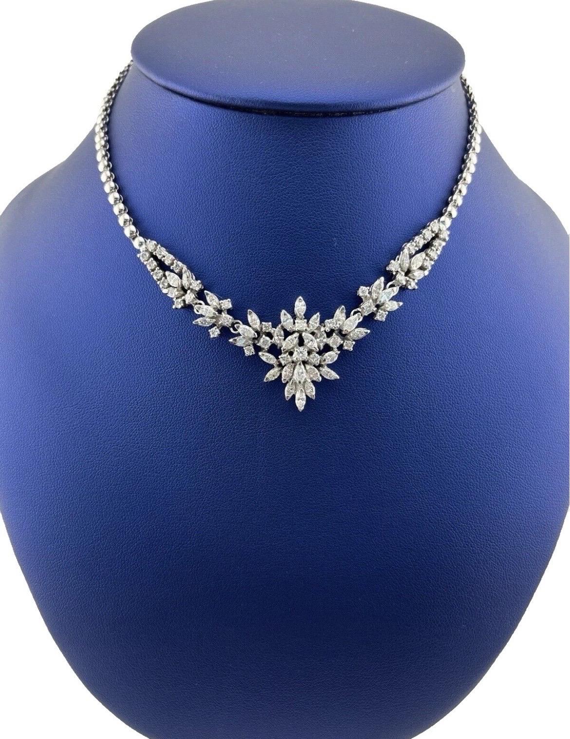 Turn heads with this dazzling estate choker necklace, exquisitely crafted in 14kt white gold and adorned with approximately 7.00 carats of round brilliant and marquise-cut diamonds. This luxurious piece combines timeless elegance with a unique