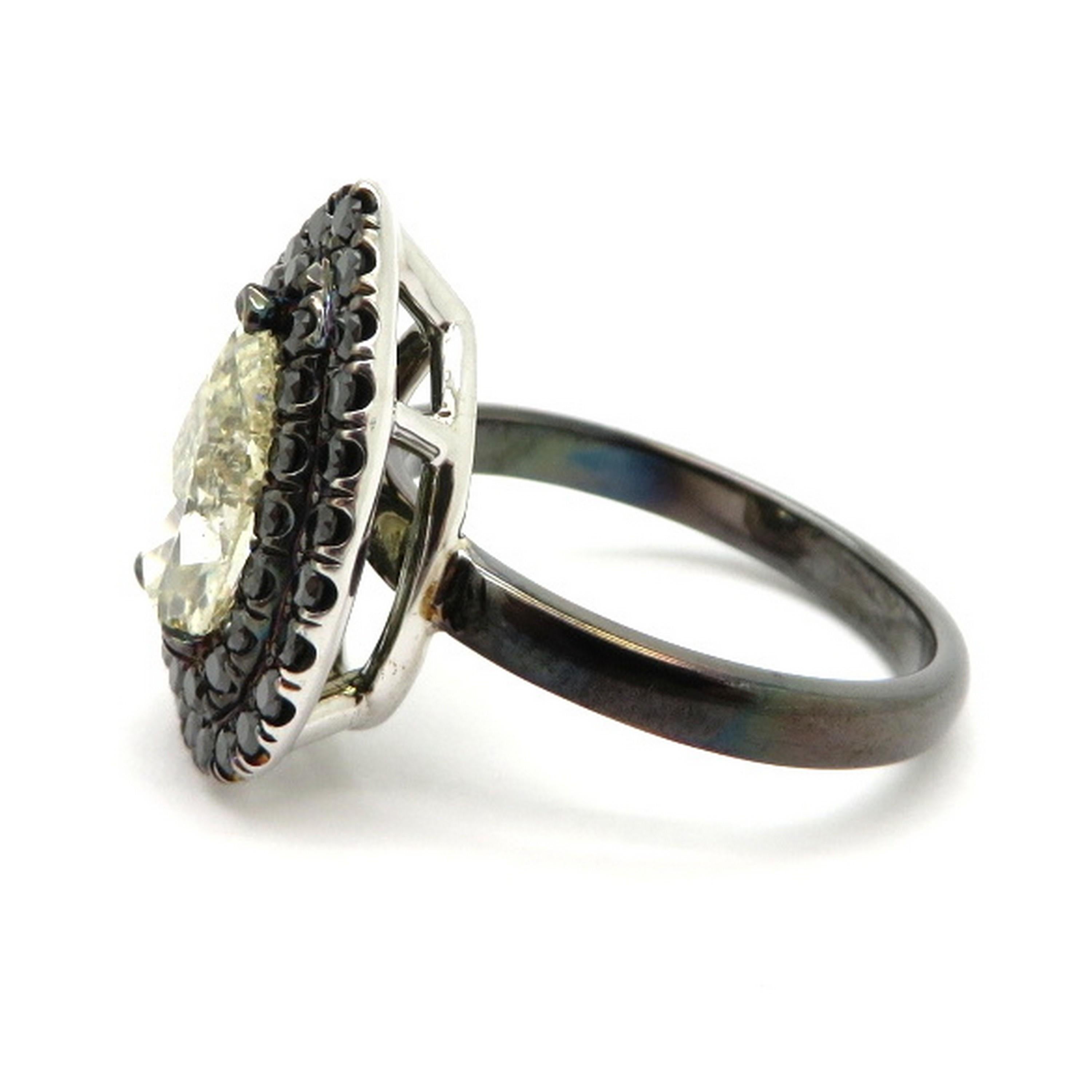 Estate 14K white gold black rhodium 1.50 carat pear shaped and pave diamond engagement ring. Showcasing one pear brilliant cut diamond, three prong set, weighing approximately 1.50 carats. Diamond grading: color grade: K. Clarity grade: SI2.