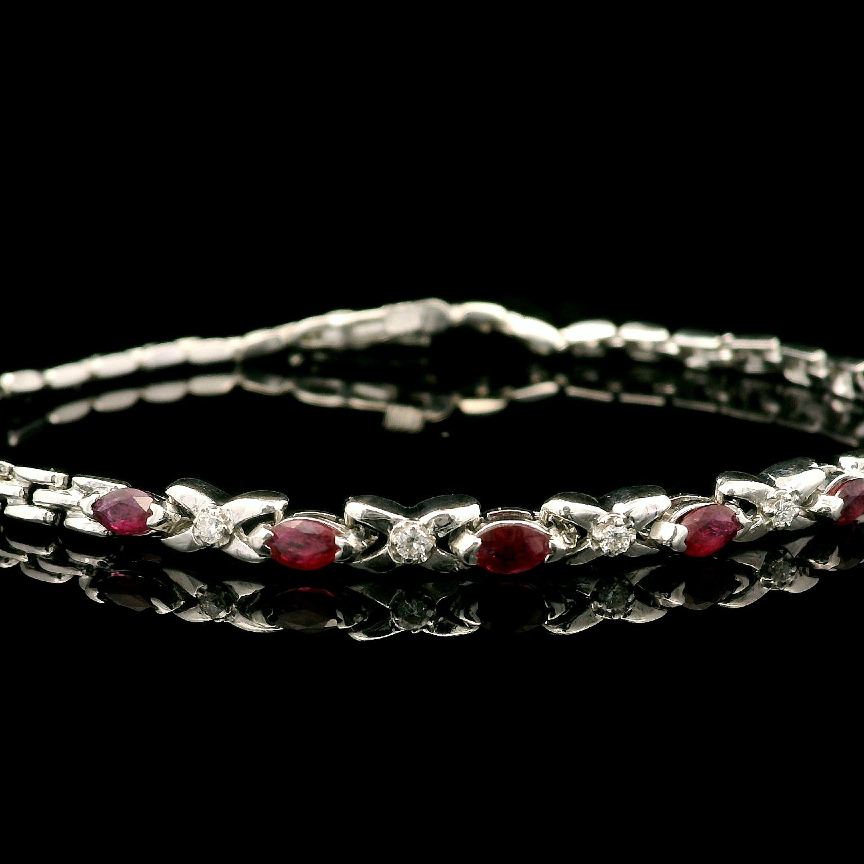–Stone(s)–
(5) Natural Genuine Ruby - Oval Brilliant Cut - Prong Set - Nice Red Color - 2.5 x 4.5mm (approx.) - 0.85ctw (approx.)
(4) Natural Genuine Diamonds - Round Brilliant Cut - Prong Set - 0.06ctw (approx.)

Material: Solid 14k White