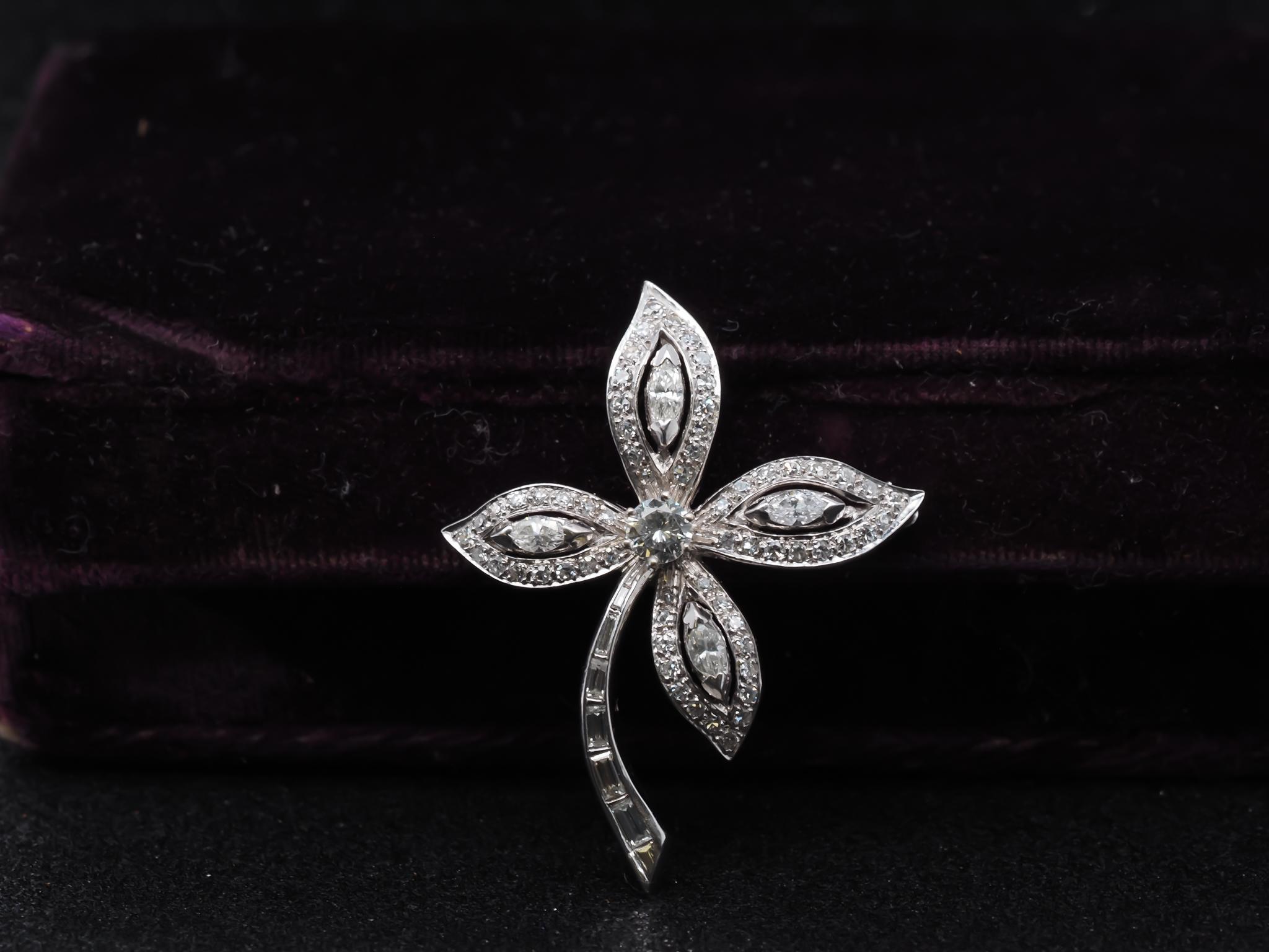 Estate 14K White Gold Flower Brooch with Diamonds - VHK#956

Item Details:
Metal Type: 14K White Gold [Hallmarked, and Tested]
Weight: 7.0 grams

Diamond Details: Center diamond weighs .50ct, and is F color, VS Clarity.

The Side stones are a mix of