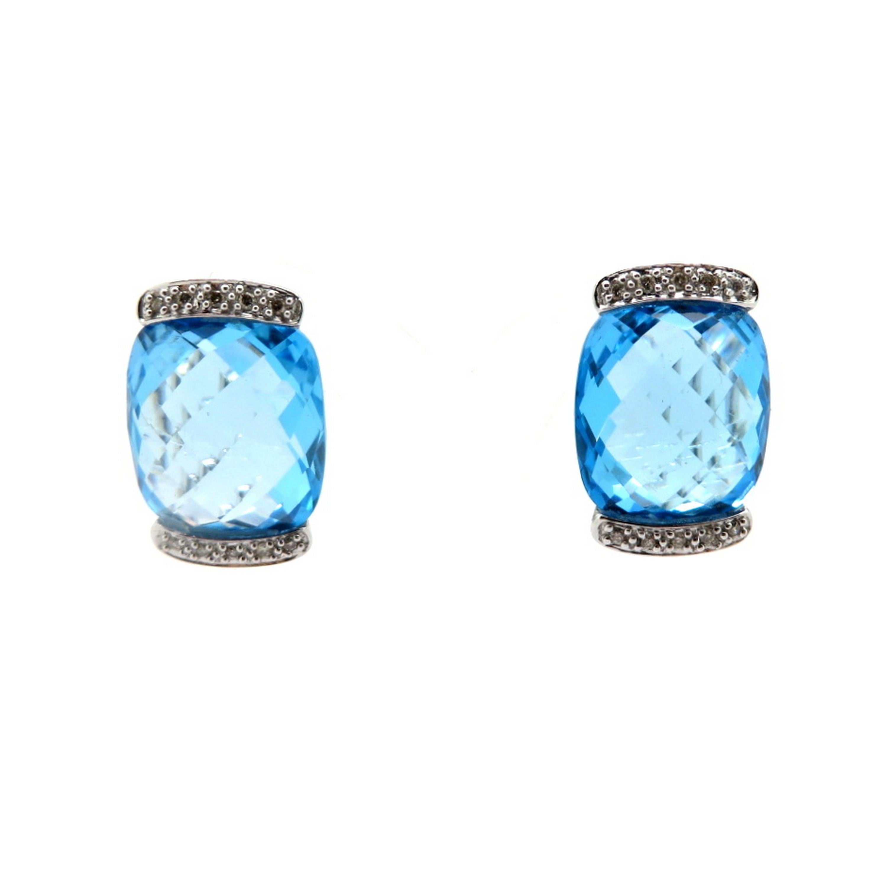 Estate 14K white gold large blue topaz and diamond fashion statement earrings. Showcasing two fine quality Swiss blue checkerboard faceted cushion cut blue topaz gemstones. Accented with 20 round brilliant cut bead set diamonds weighing a combined