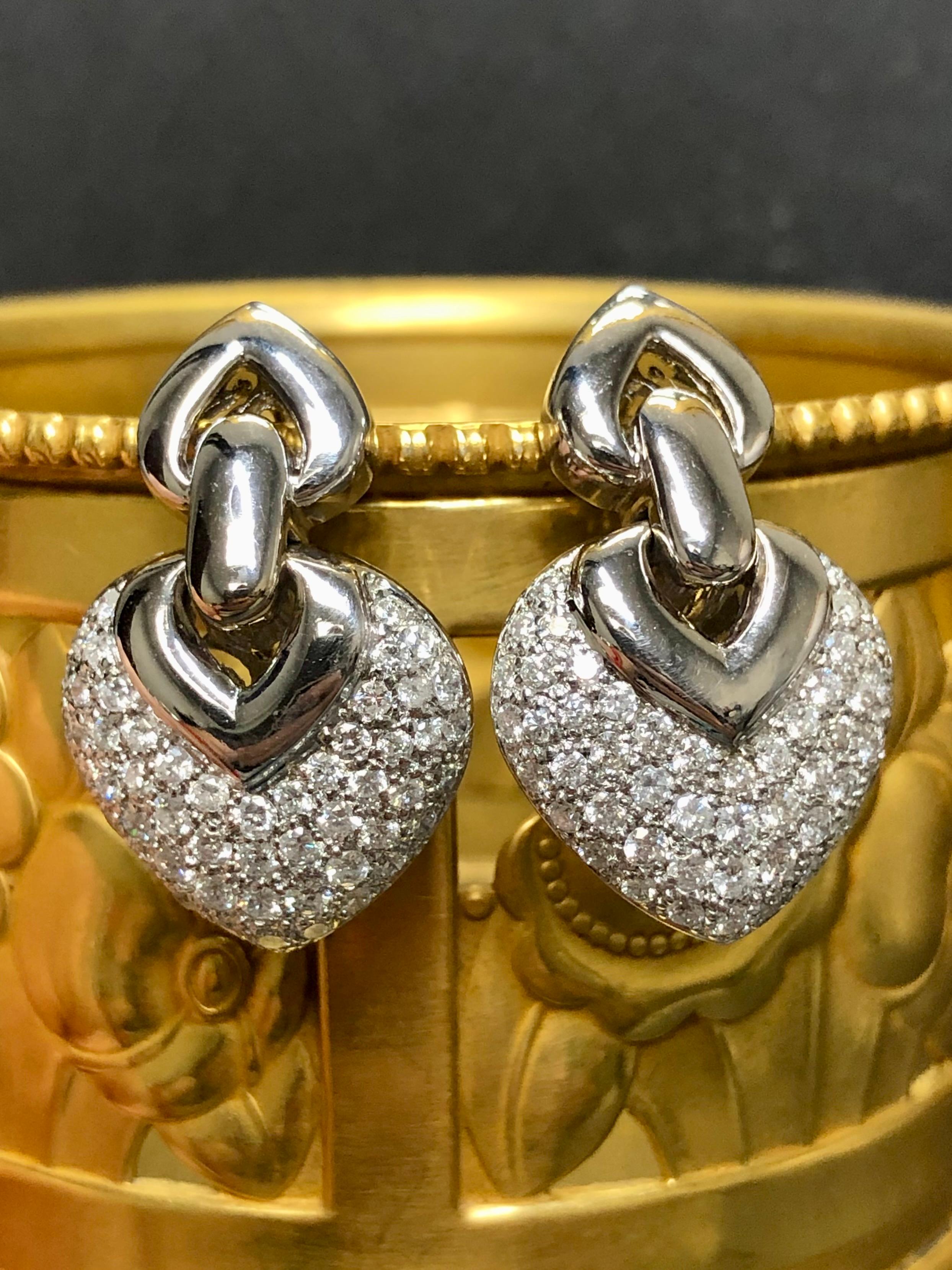
A classic pair of diamond earrings done in 14K white gold set with approximately 3cttw in G-H color Vs2-Si2 clarity round diamonds. Posts with omega backs.


Dimensions/Weight:

Earrings measure 1.25” x .75” and weigh 15.5g.


Condition:

All