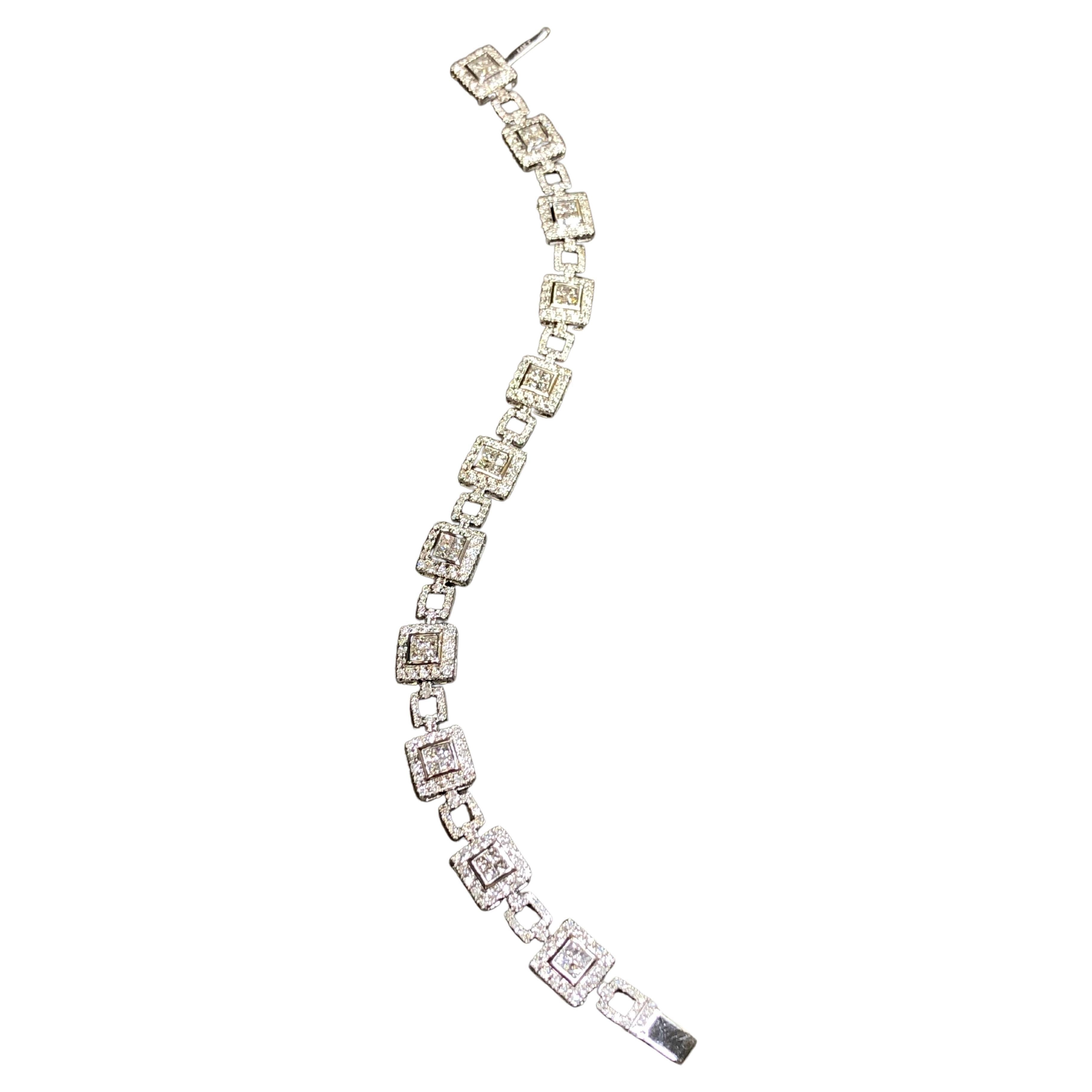 
A fashionably stunning contemporary bracelet done in 14K white gold and set with approximately 5.10cttw in round and princess cut diamonds ranging H-J in color and Si1-i1 in clarity. There isn’t a dull section in this piece and as you can say it