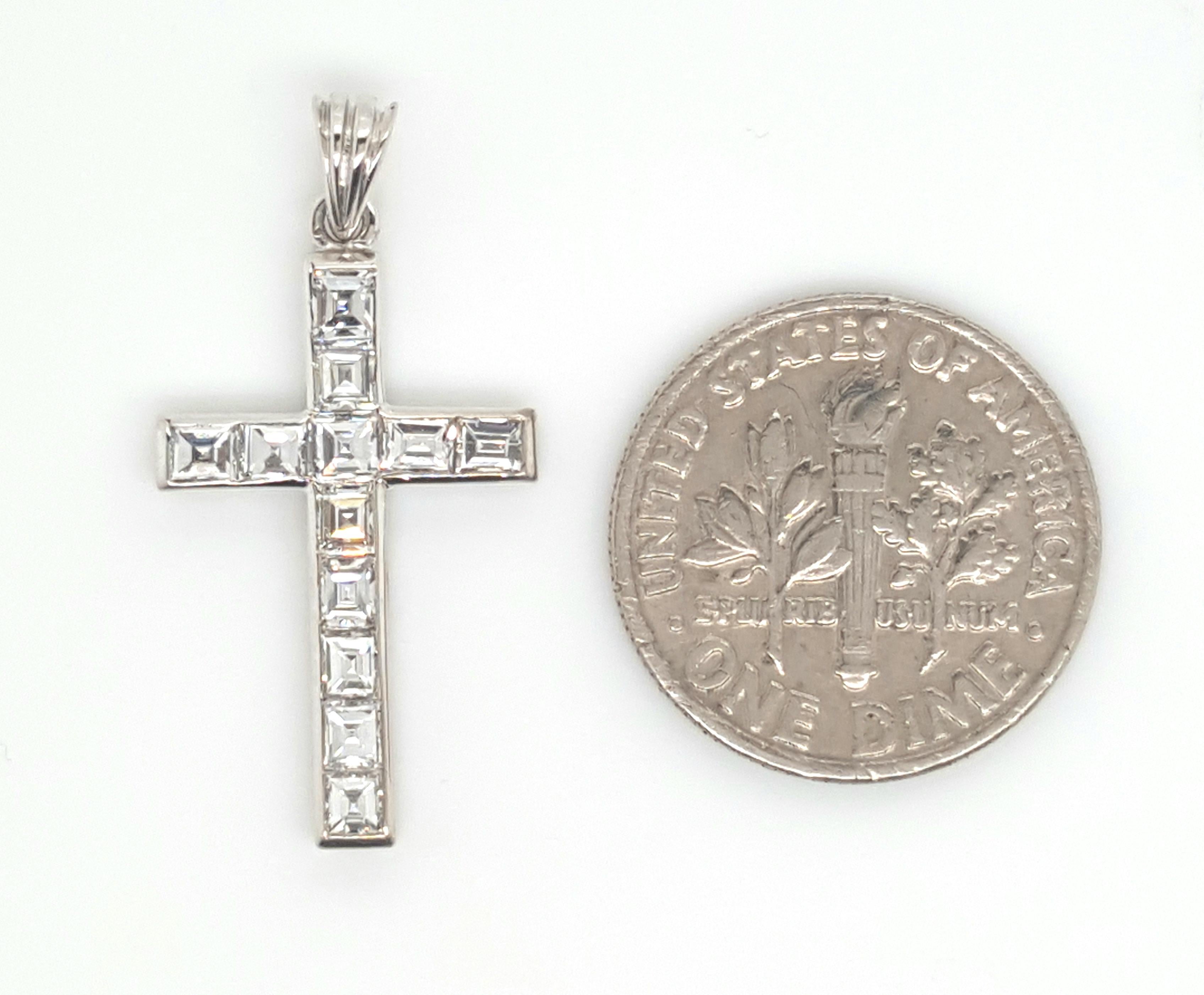 Estate 14K White Gold Square step Cut Diamond Cross Pendant.  This delicate white gold cross encased beautifully matched square cut diamonds accented by an airline gallery.  Diamonds weigh a total of approximately 1.5 carats VS clarity and G - H in
