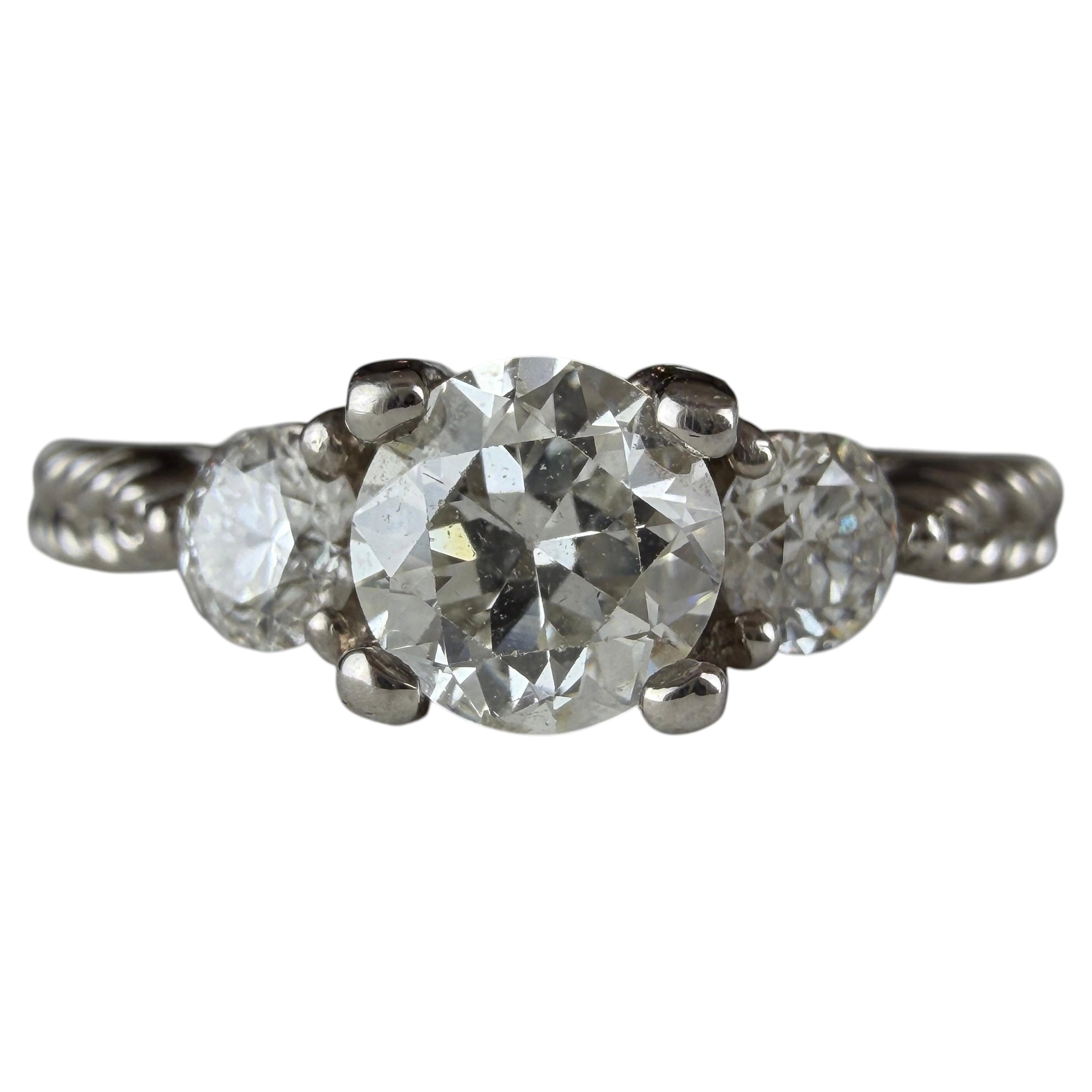 What does the 3 diamonds on an engagement ring mean?