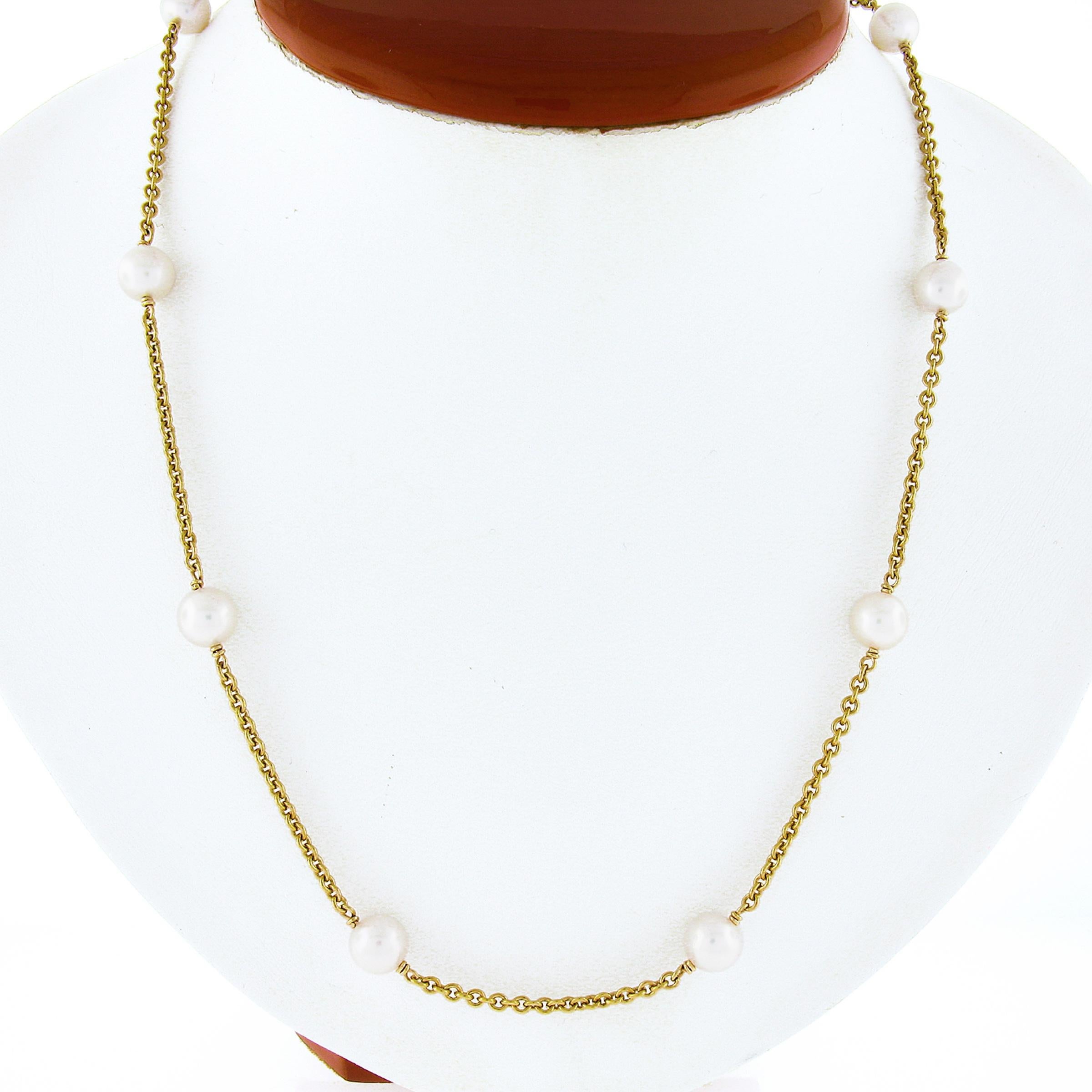 Here we have a gorgeous pearl by the yard style necklace crafted in solid 14k yellow gold and features 12 round cultured pearls neatly and evenly spaced out throughout the solid 23 inches cable link chain. These wonderful pearls are well matched in