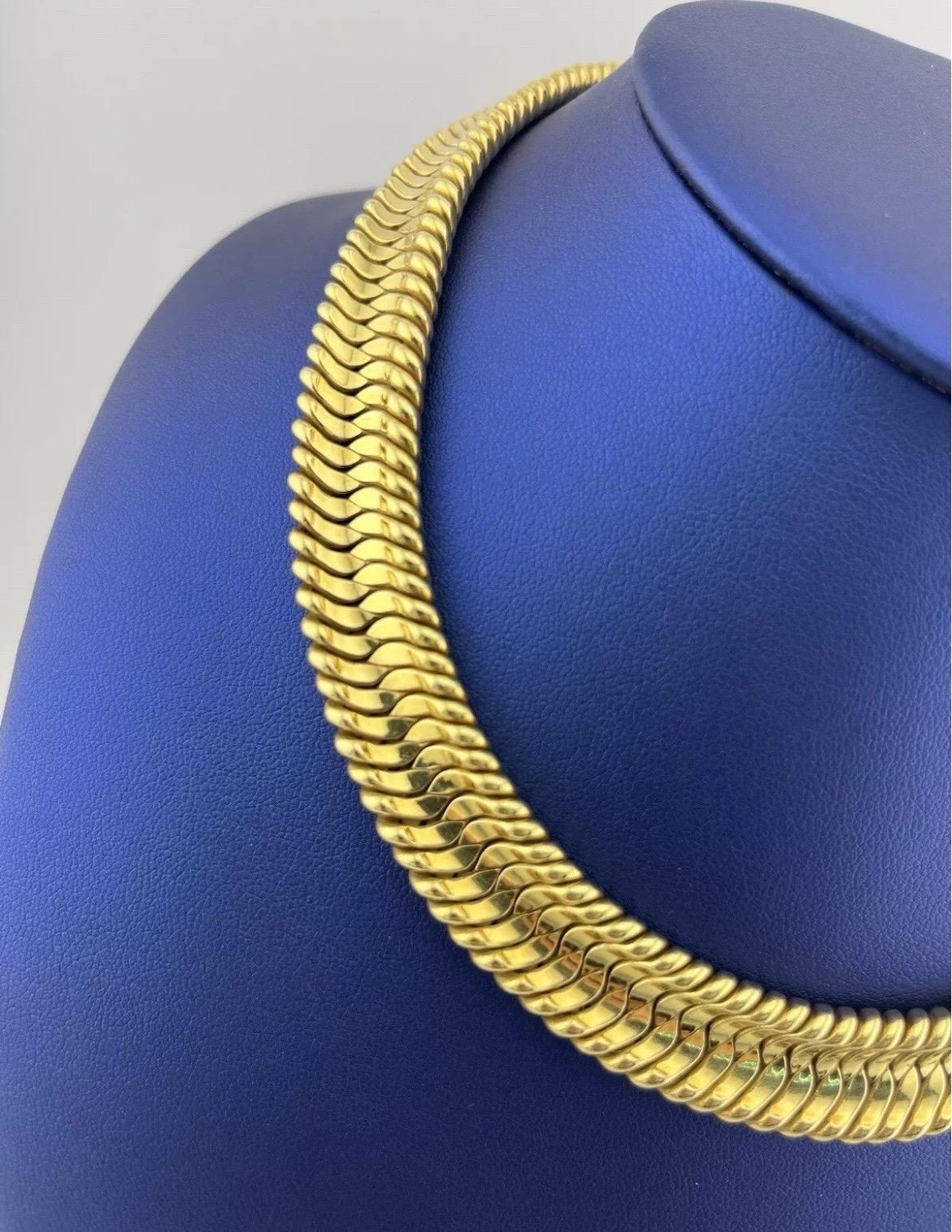 The Estate 14k Yellow Gold Italian Flexible Choker Necklace is a timeless piece that showcases Italian craftsmanship at its finest. Crafted from high-quality 14k yellow gold, this choker features a flexible, fluid design that comfortably molds to