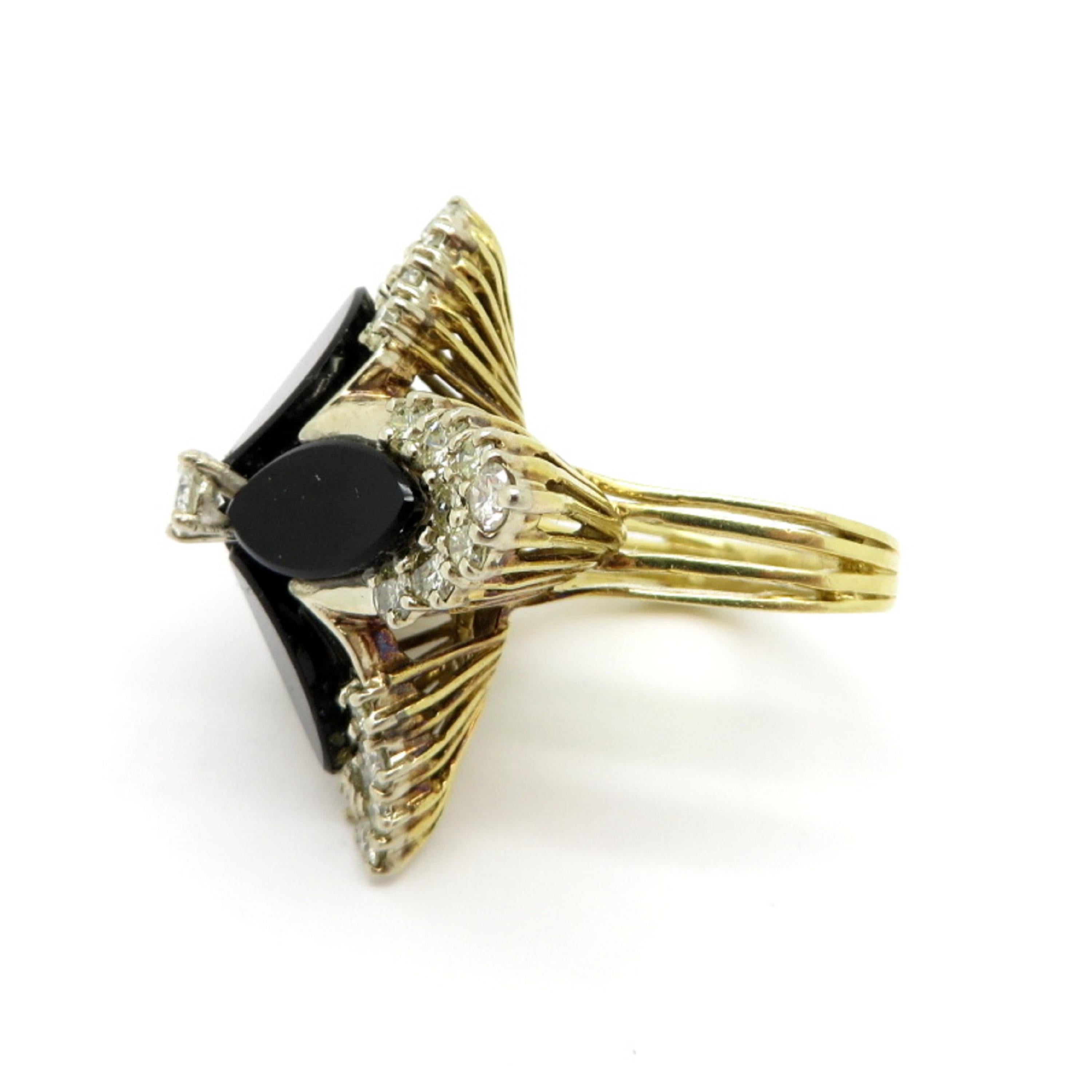 Estate 14K yellow gold onyx flower design diamond ring. Showcasing 33 round brilliant cut prong set diamonds weighing a total of 1.75 carats. Featuring four onyx gemstones inlaid in the shape of flower petals. The ring features a triangle shaped