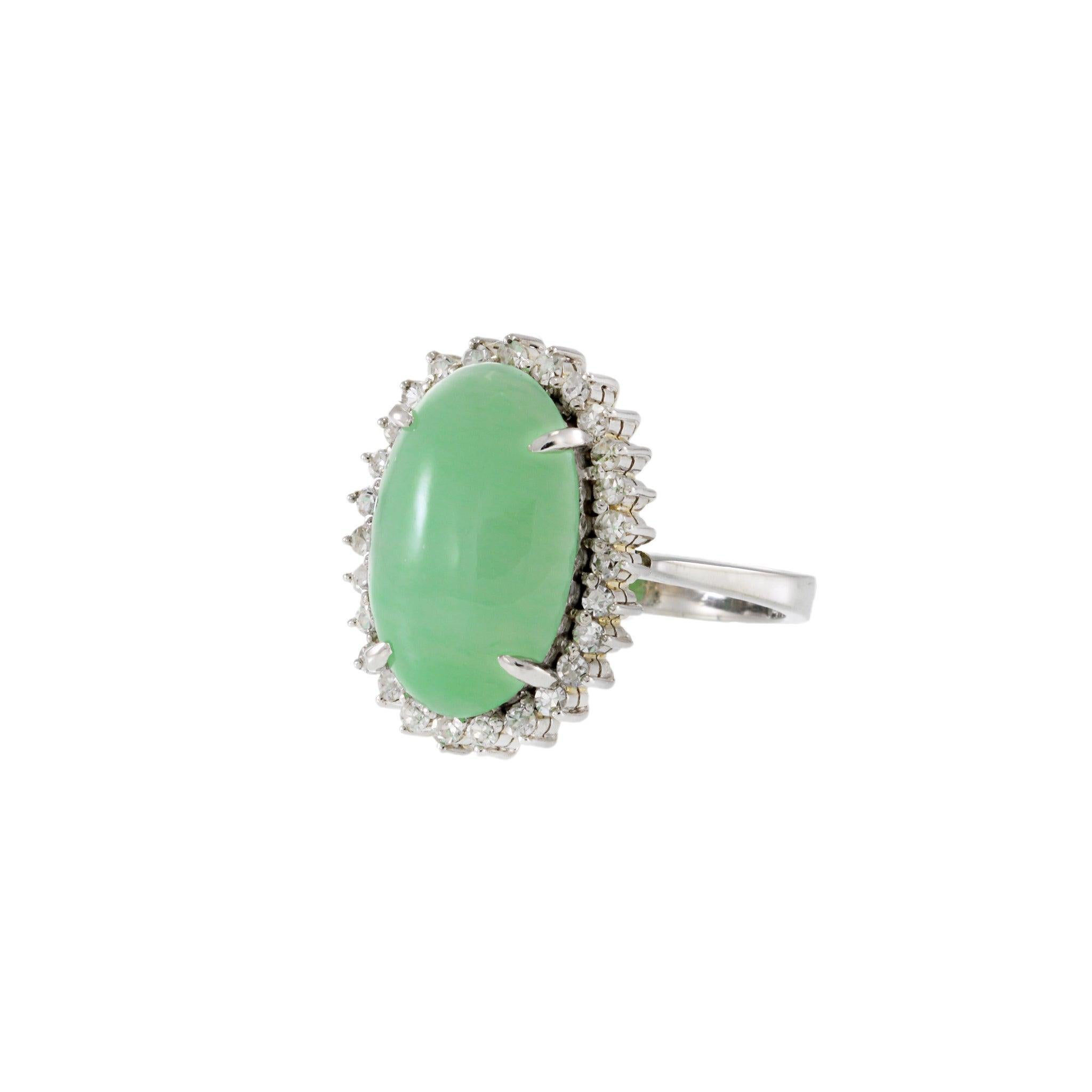A refined estate piece that draws the eye with its serene green jade center. Set in 14KT white gold and framed by 1.16 carats of brilliant diamonds, this ring offers an elegant balance of soft color and radiant sparkle.

Metal: 14KT White