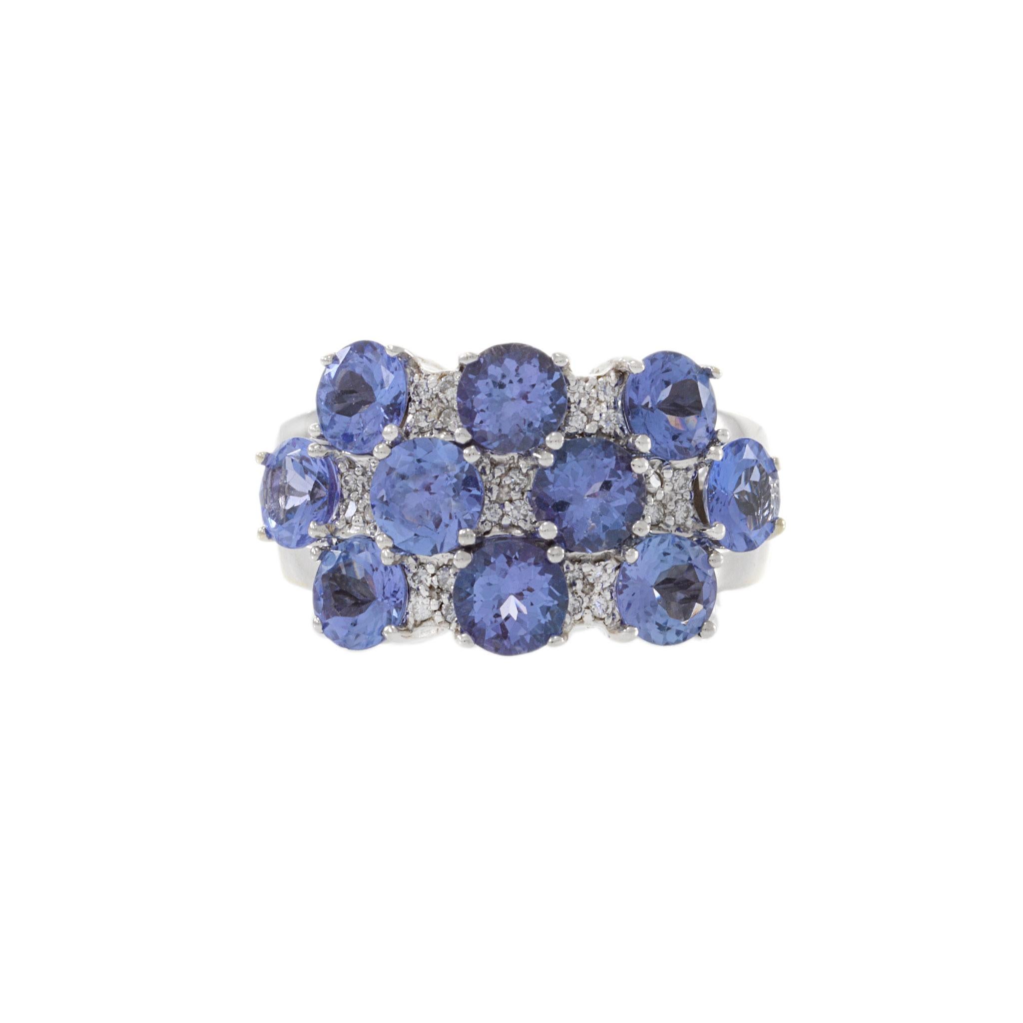 A ring that's rich with stunning tanzanite and 0.22CT-TW sparkling diamonds, handcrafted in 14KT white gold for an exquisite and timeless piece. Size 6.75 US. Weight 11.6 gm.