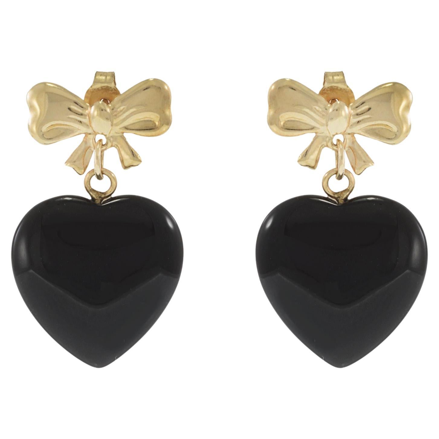 Orecchini a fiocco in oro giallo 14KT con cuori pendenti di onice nera in vendita