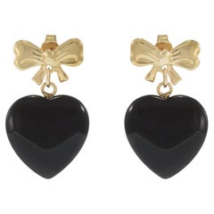 Orecchini a fiocco in oro giallo 14KT con cuori pendenti di onice nera