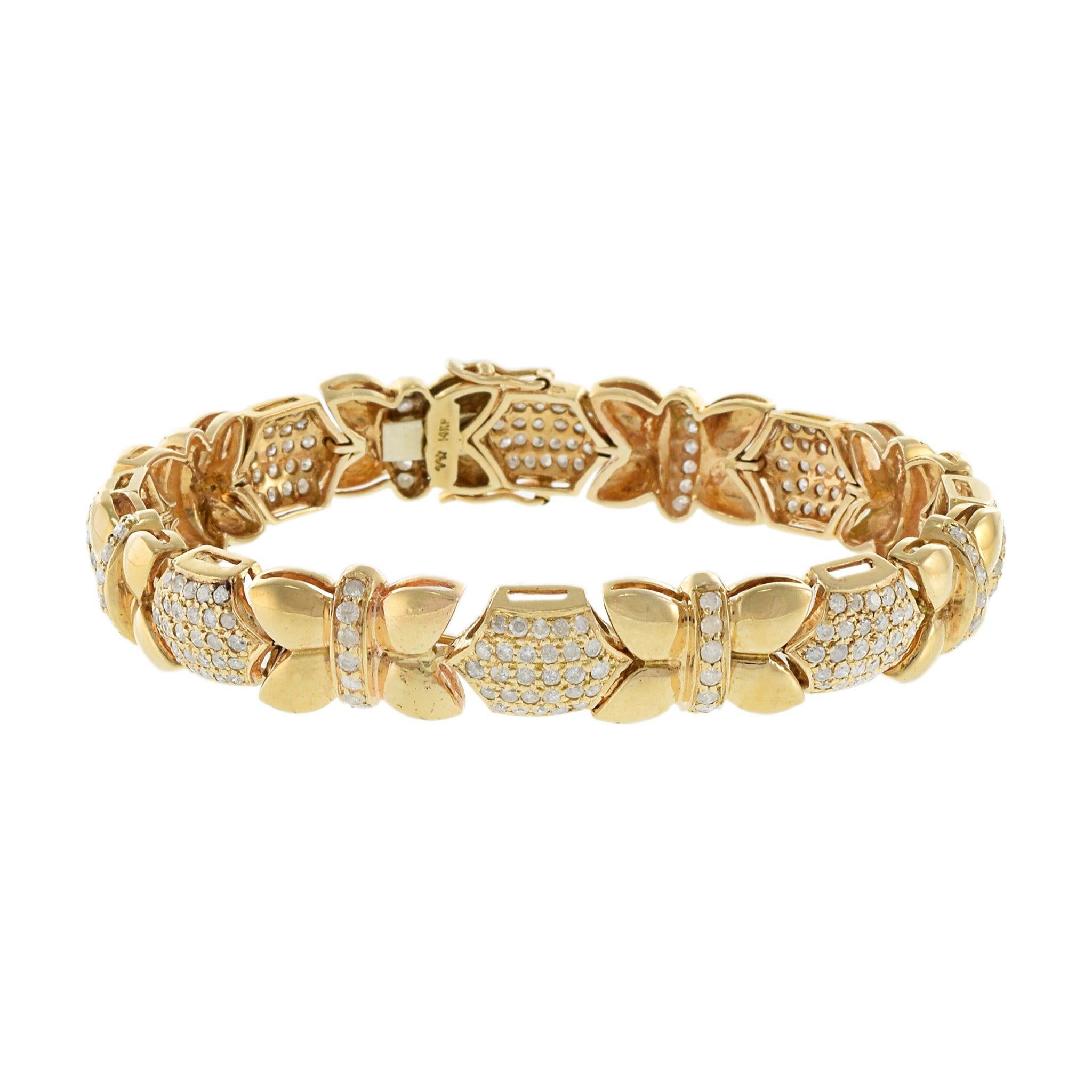 Estate 14KT Yellow Gold Petals and Diamond Bracelet. This exquisite bracelet features a luxurious design of gold petals, each embellished with I-I1 round cut diamonds totaling 3.50 carats. Weighing 26.8 grams, the piece combines substantial weight