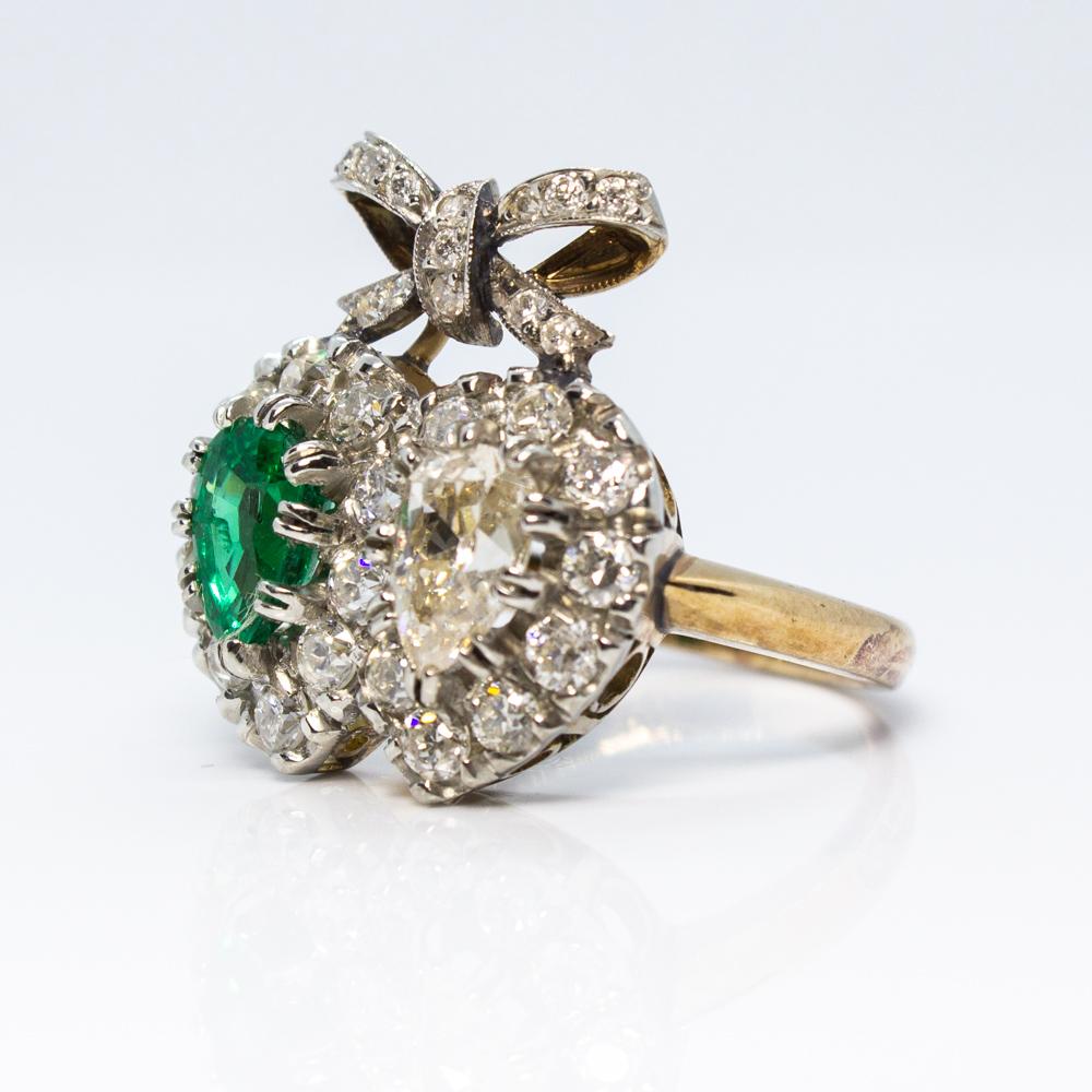 Composition: 18K Gold and platinum.
Stones:
•	1 natural tear shape Colombian cut emerald that weighs 0.90ctw.
•	1 natural tear shape diamond of L-SI1 quality that weighs 0.80ctw.
•	30 Old mine cut diamonds of I-VS2 quality that weigh 1.20ctw.
Ring