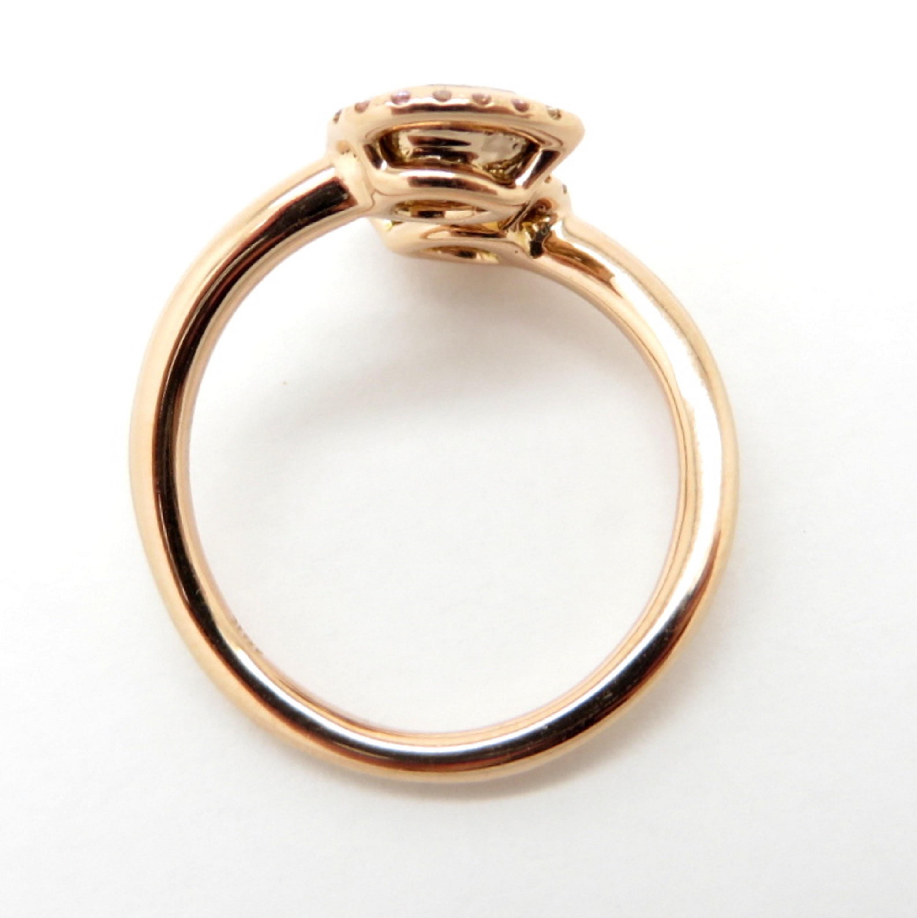 Contemporary Estate 18 Karat Rose Gold Bypass Pear Shaped Pink Diamond Halo Ring For Sale