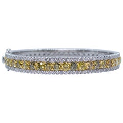 Estate 18 Karat Two-Tone Gold 5.50 Carat Yellow 
White Diamond Bangle Bracelet